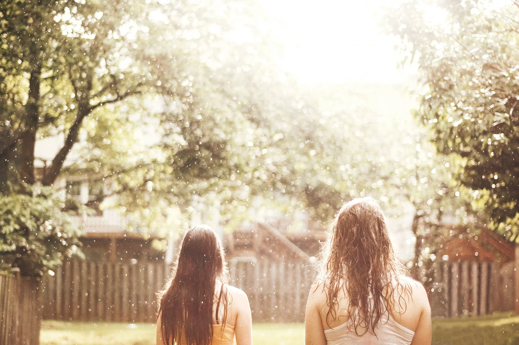 girls-summer-rainstorm-suburban-neighborhood.jpg