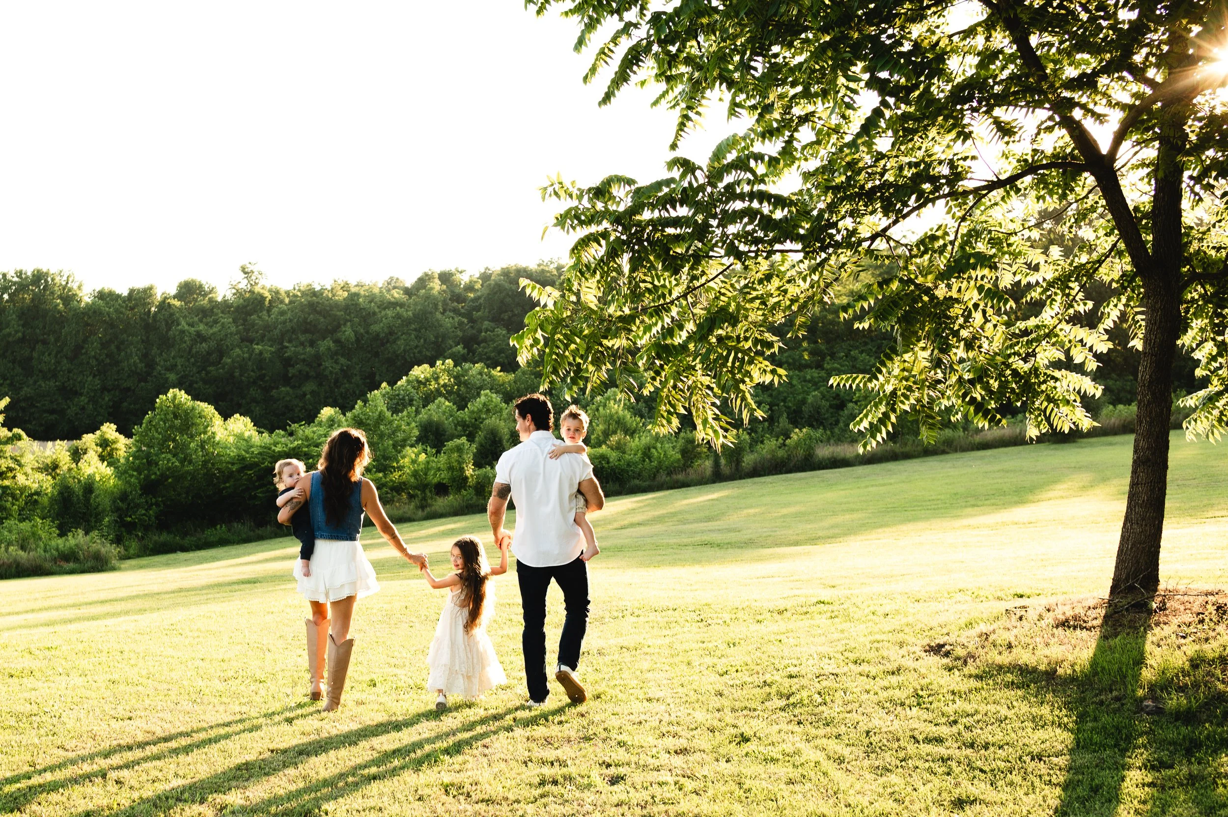 family walking in open field, family photography, photographer, clarksville and nashville tennessee