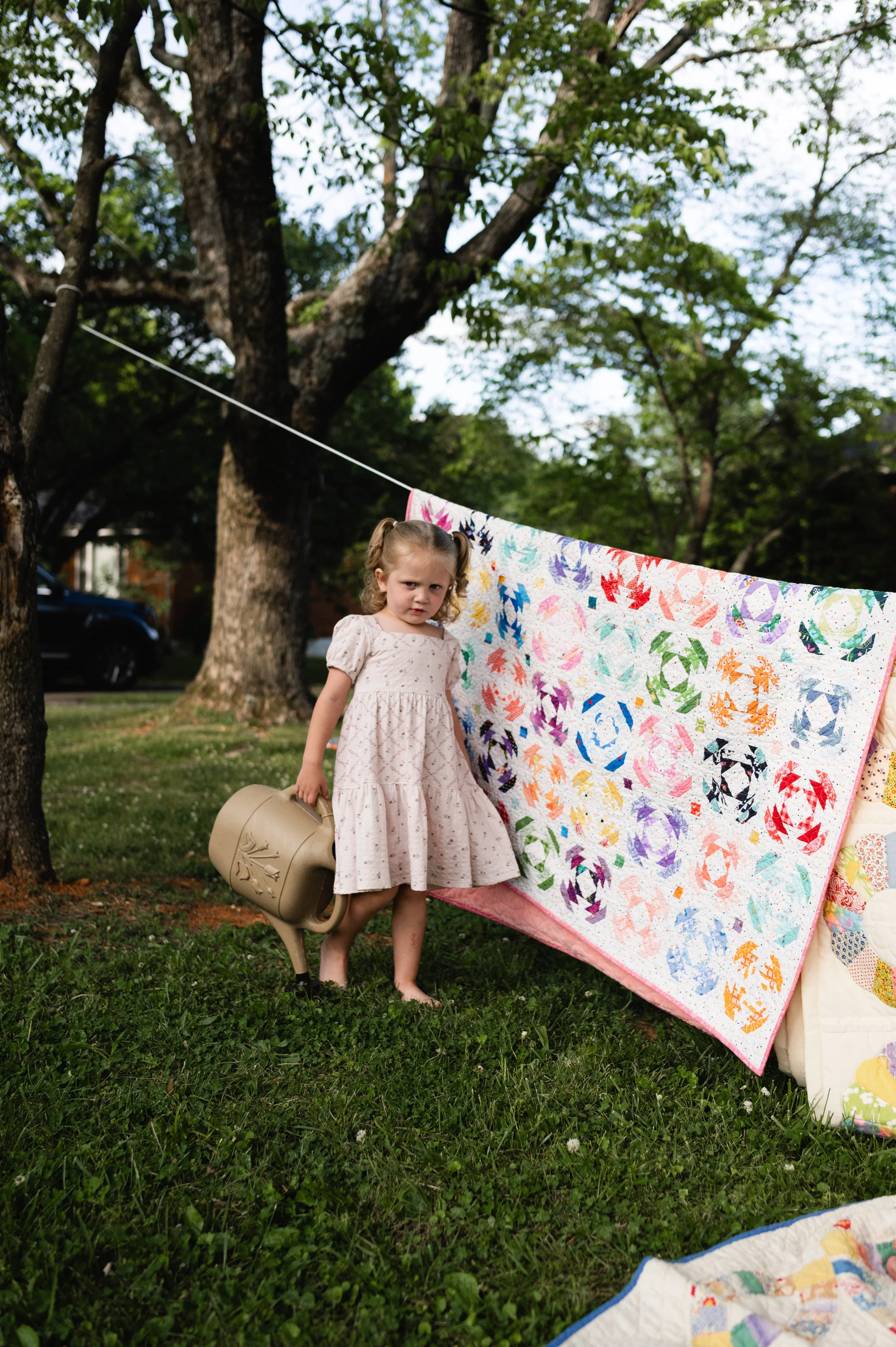girl with watering can, affordable, family photographer, clarksville tn, nashville tn