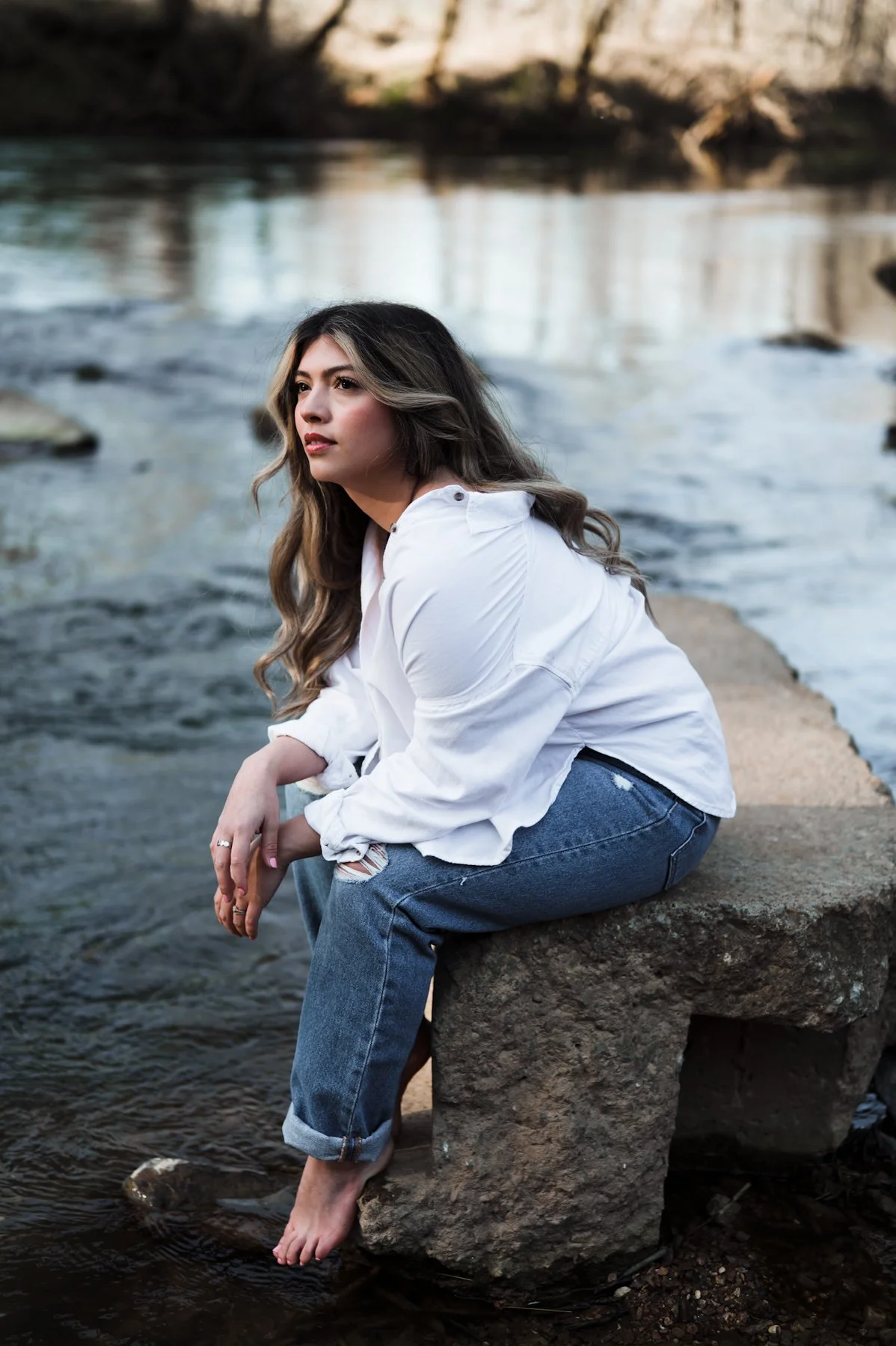brunette-woman-river-sunset-winter.jpg