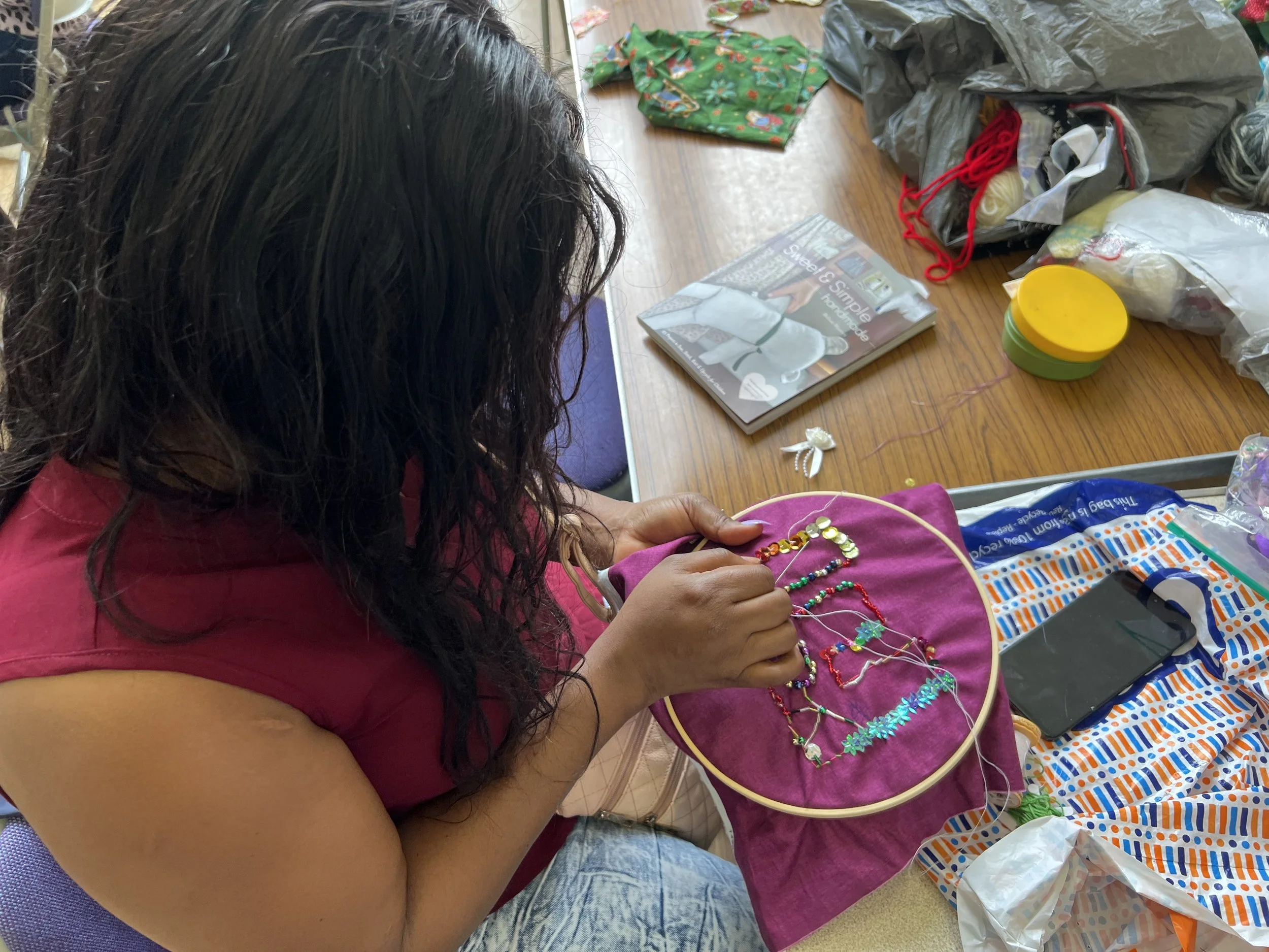 A member of Sanctuary in Chichester sewing the Madge Flag