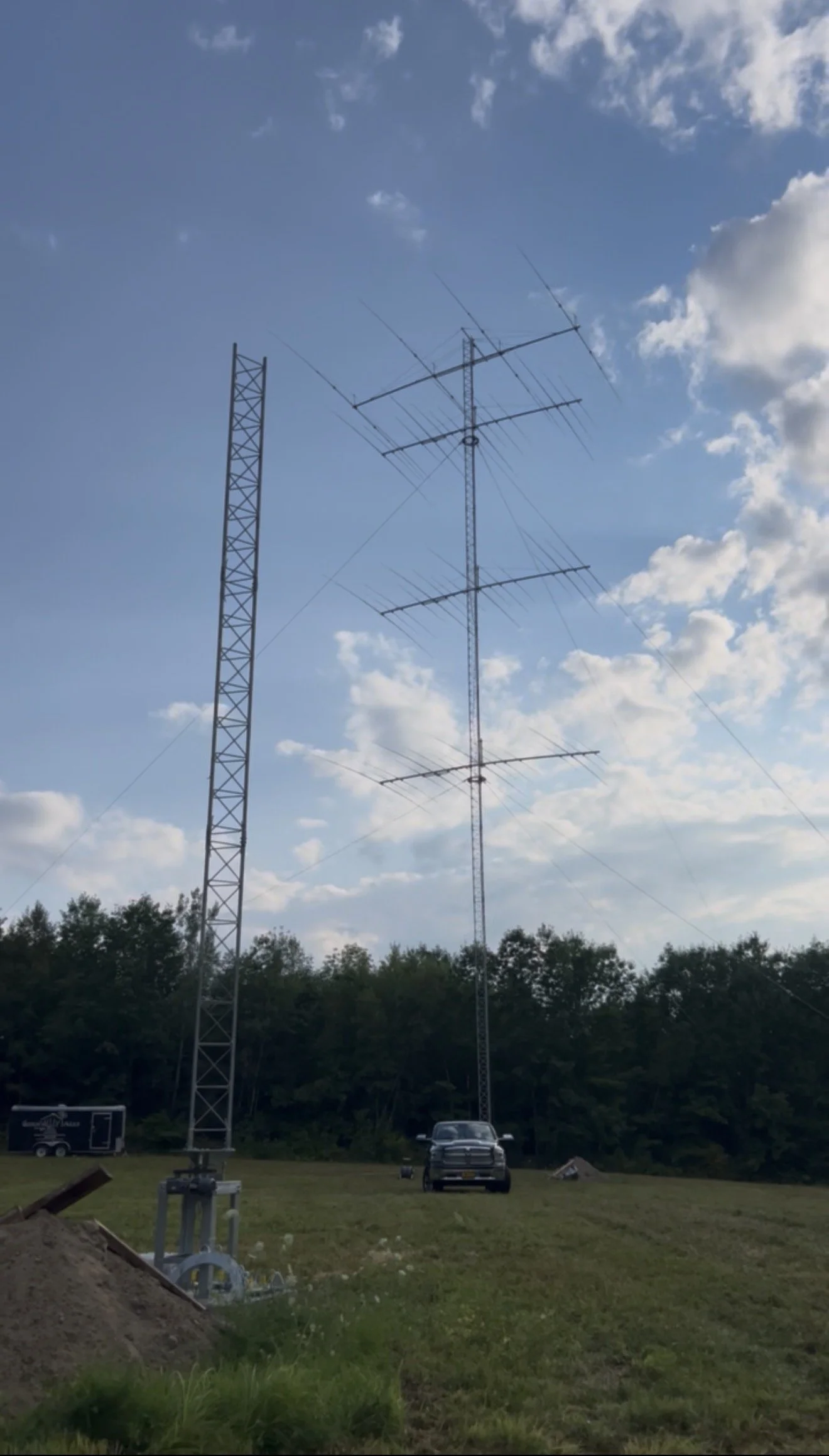 Dual rotating tower build complete — Rohn 55G guyed tower installation with motorized rotating base and ring assembly, New England