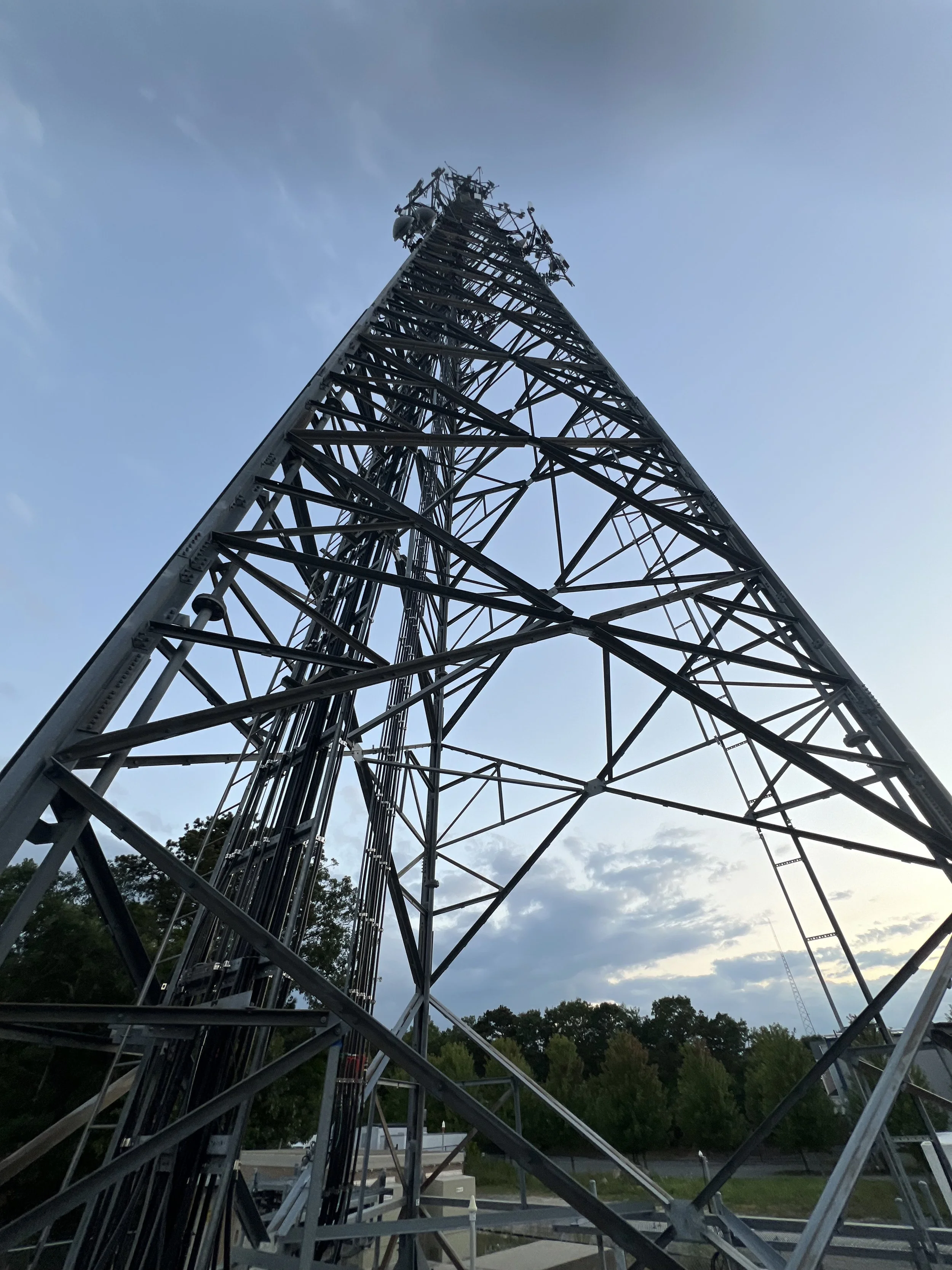 Low angle view of guyed telecommunications tower — tower erection and inspection contractor serving New England and nationwide