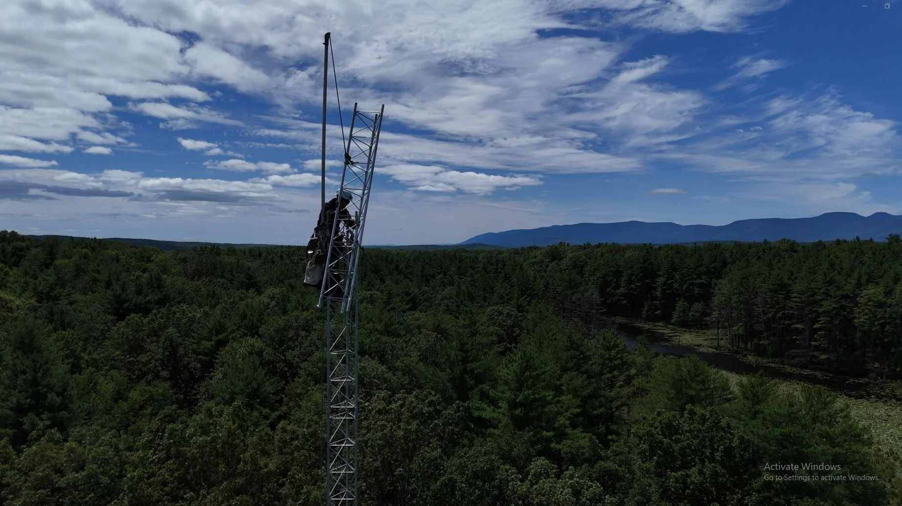 Installing tower section with gin pole — Rohn guyed tower erection contractor serving New England and nationwide