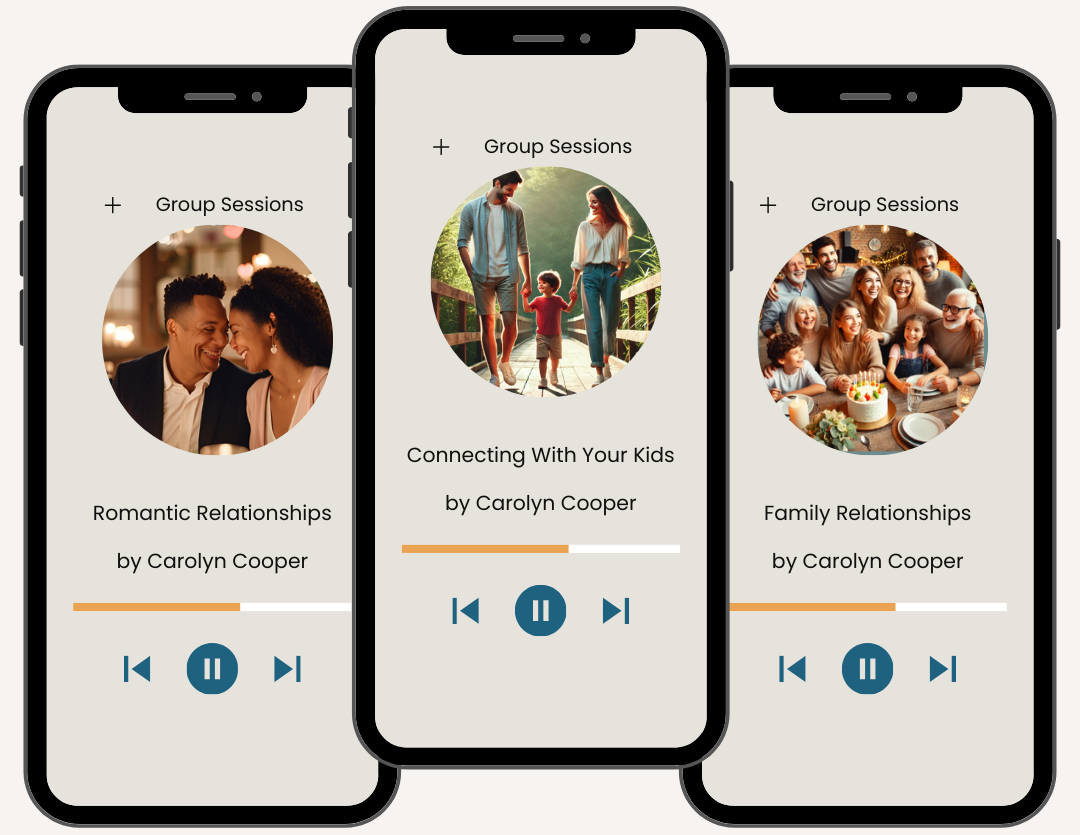 A family of four walking together in a grassy field during sunset.