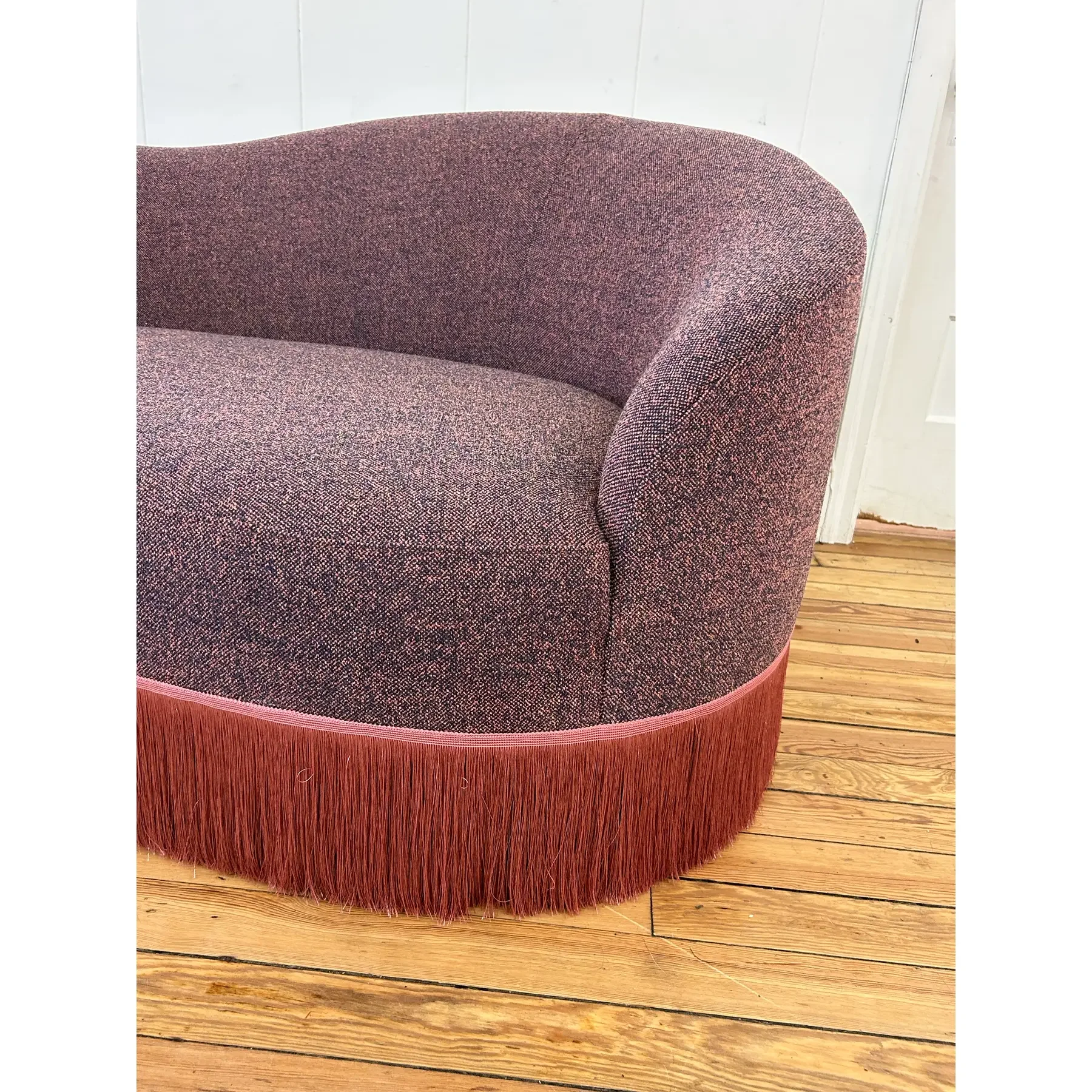curved-sofa-custom-upholstered-in-maharam-gale-fabric-color-diorite-see-photos-and-trimmed-in-pink-fringe-6101.webp