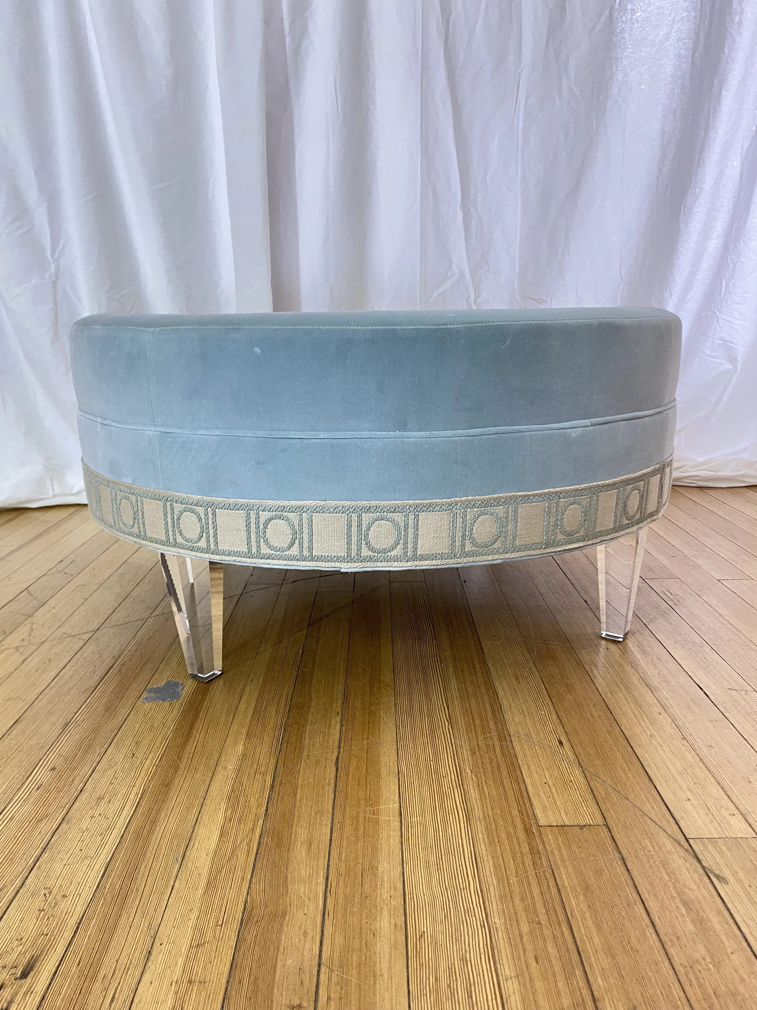 kravet-upholstered-coffee-table-lucite-legs-and-front.jpg
