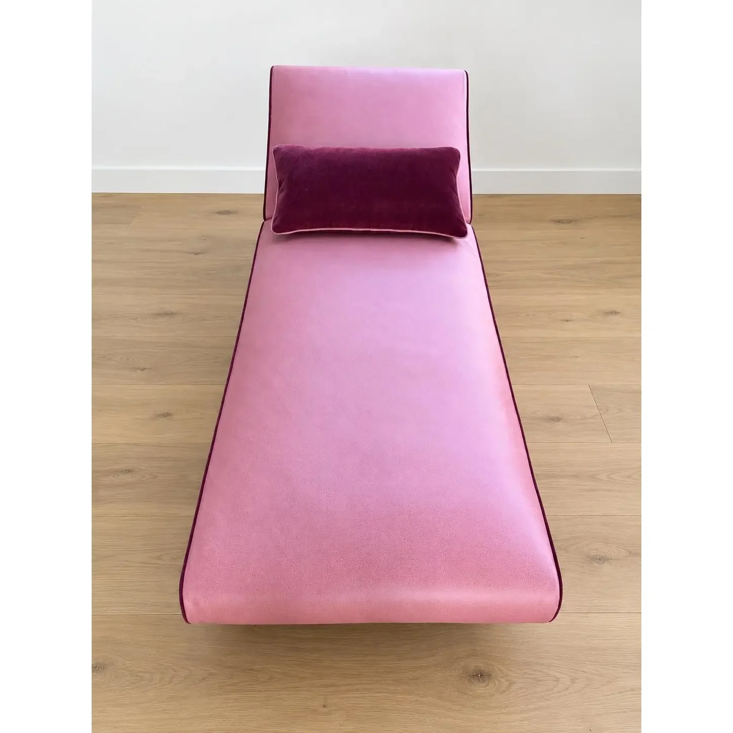 mid-century-modern-chaise-with-adjustable-head-rest-freshly-reupholstered-in-pink-leather-accented-with-cherry-mohair-welting-0116.webp