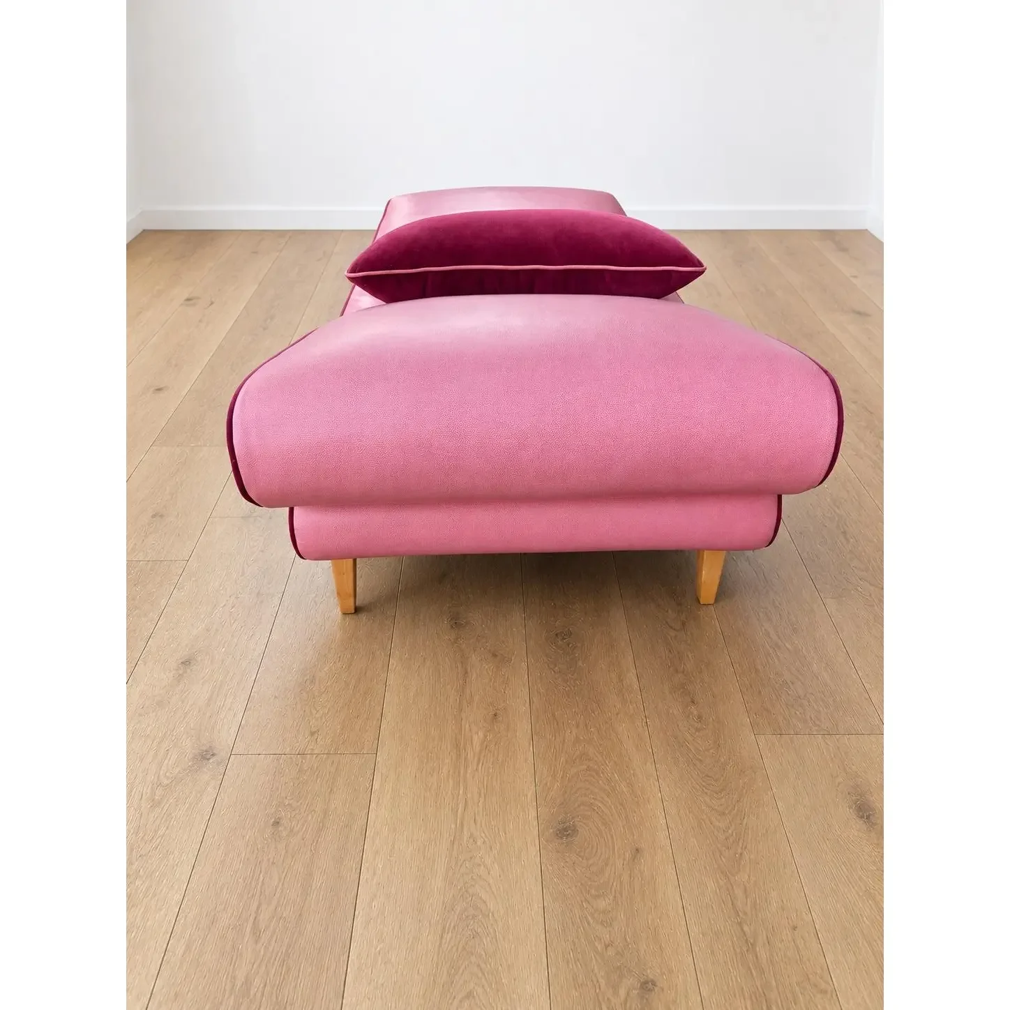 mid-century-modern-chaise-with-adjustable-head-rest-freshly-reupholstered-in-pink-leather-accented-with-cherry-mohair-welting-0265.webp
