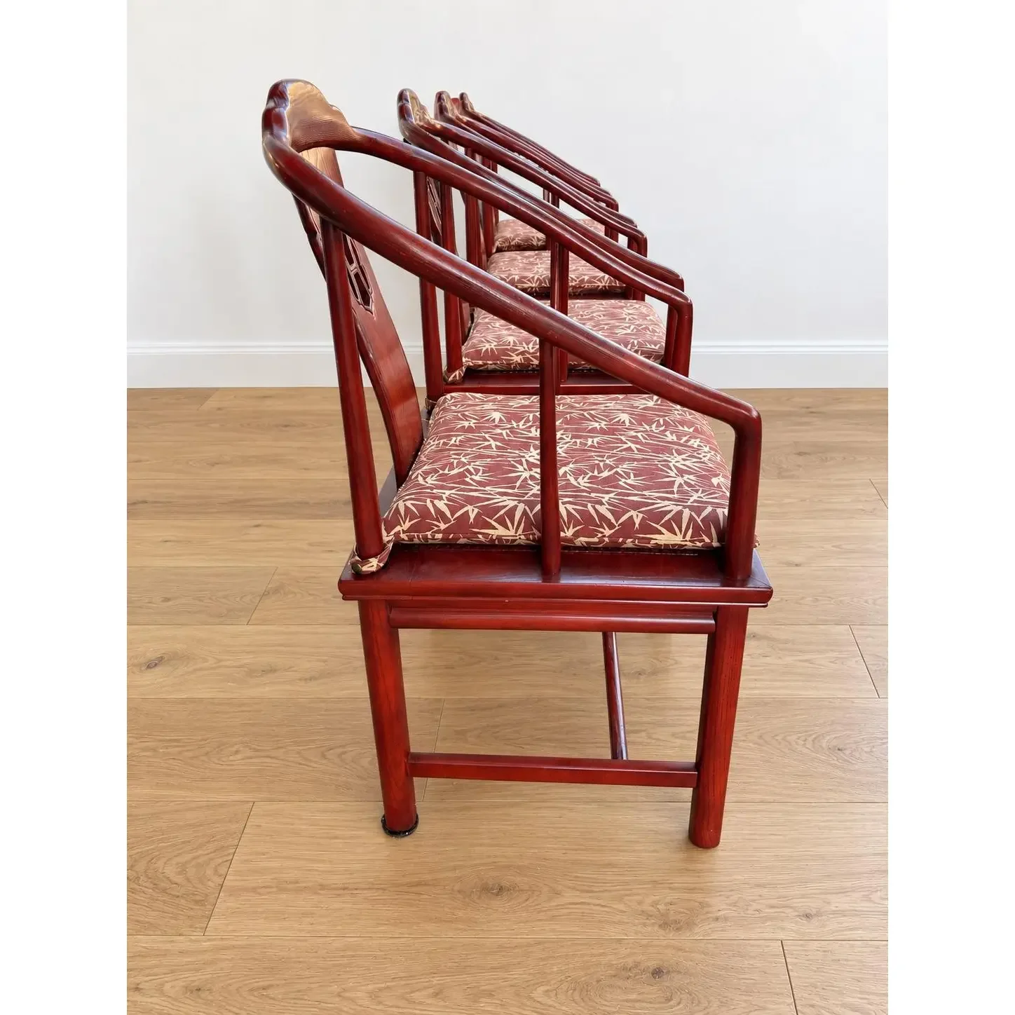 vintage-chinese-horseshoe-back-arm-chairs-with-palm-pattern-seat-cushions-set-of-4-6069.webp
