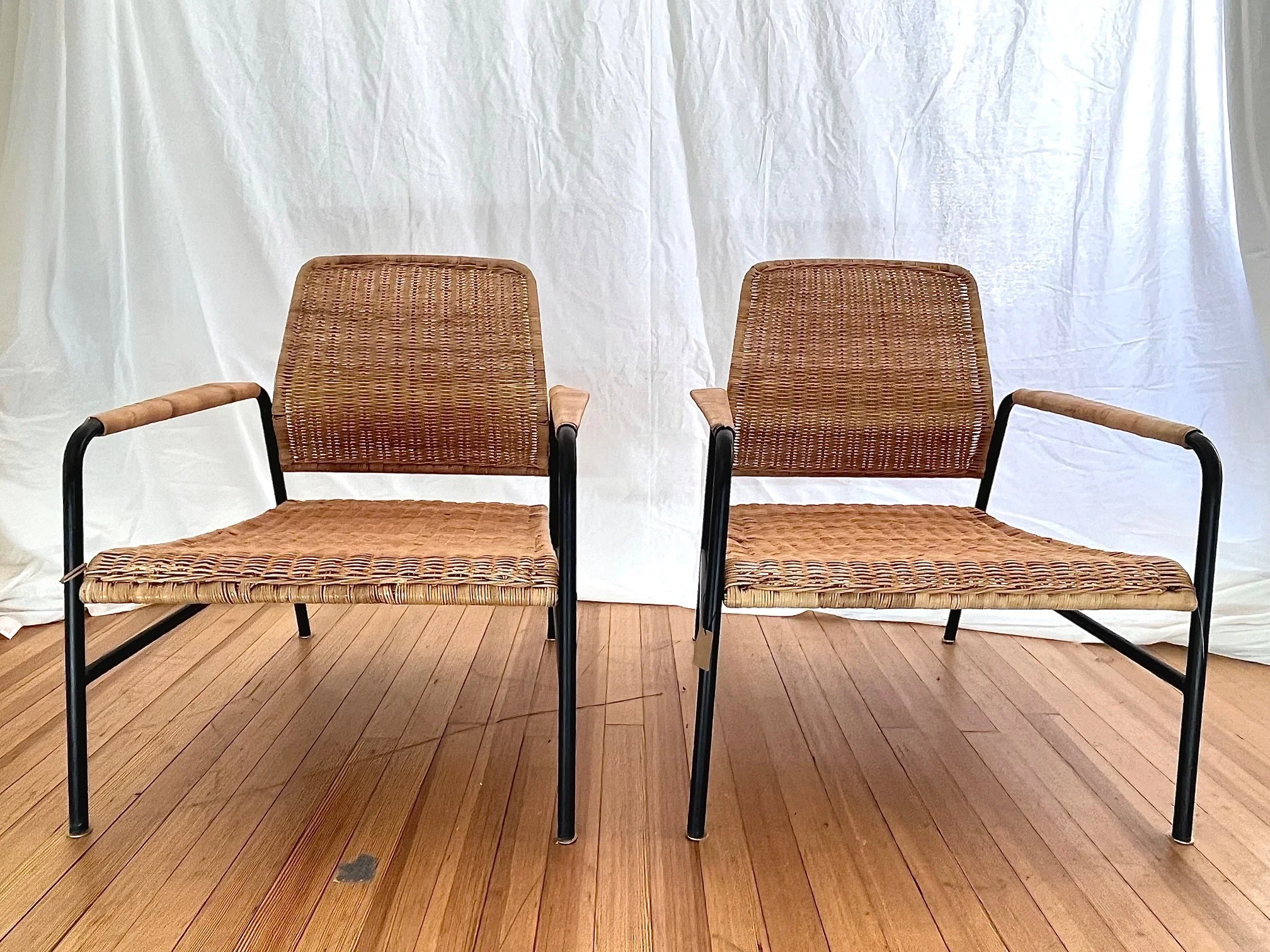 woven-rattan-armchairs-black-metal-frame-set-of-2-front.jpg