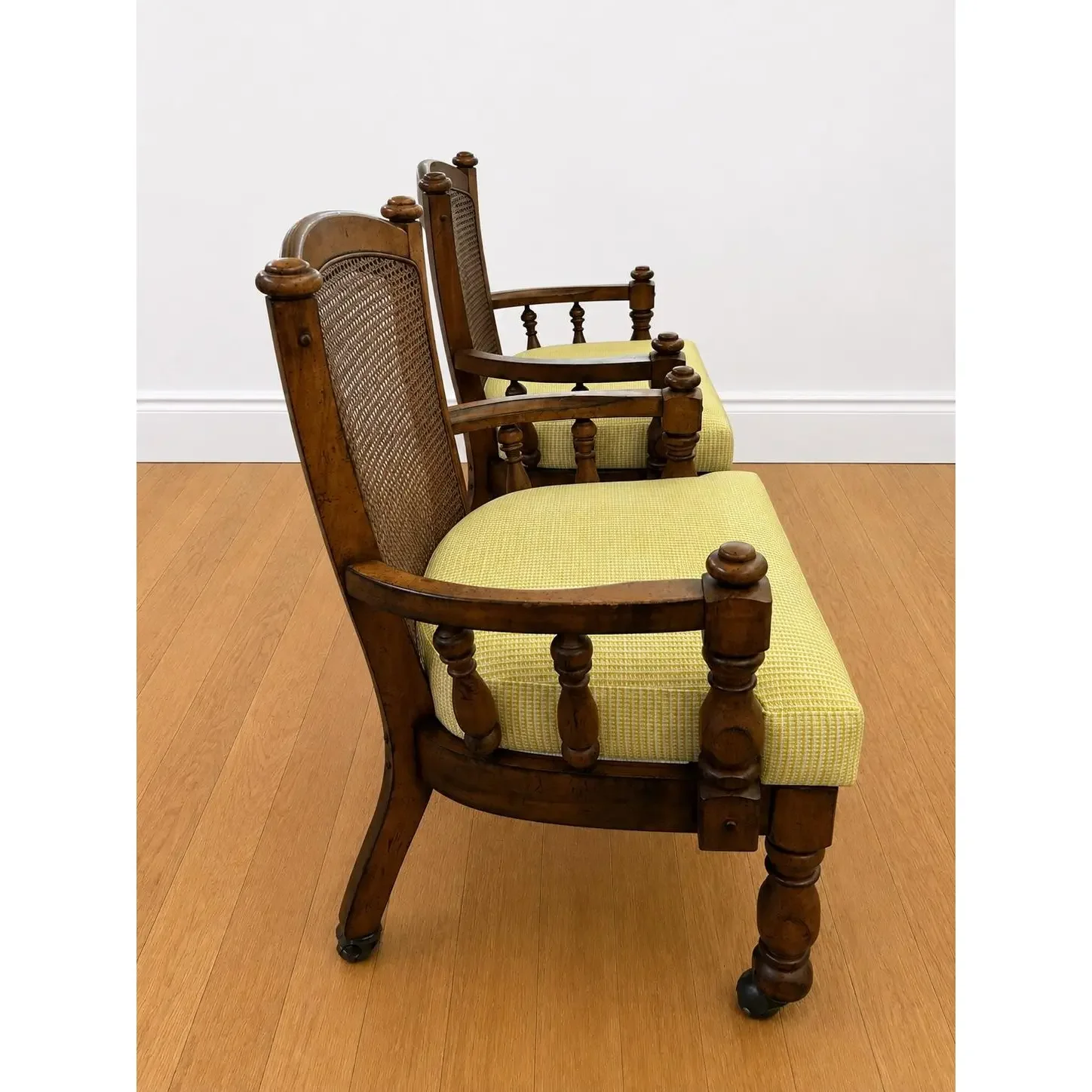 pair-of-1970s-kane-back-captains-chairs-antiqued-walnut-stained-frames-new-seat-cushions-with-new-upholstery-9509.webp
