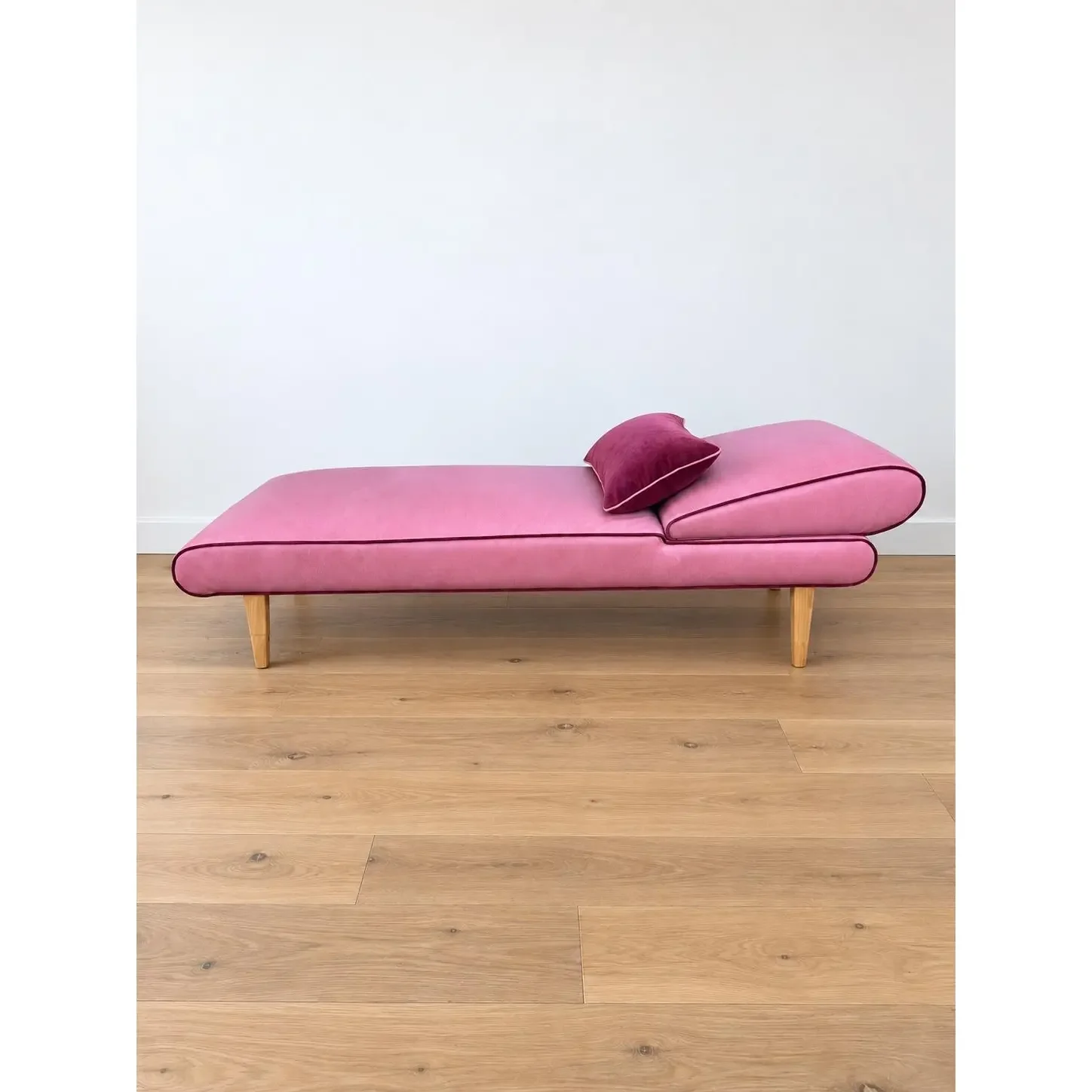 mid-century-modern-chaise-with-adjustable-head-rest-freshly-reupholstered-in-pink-leather-accented-with-cherry-mohair-welting-7948.webp