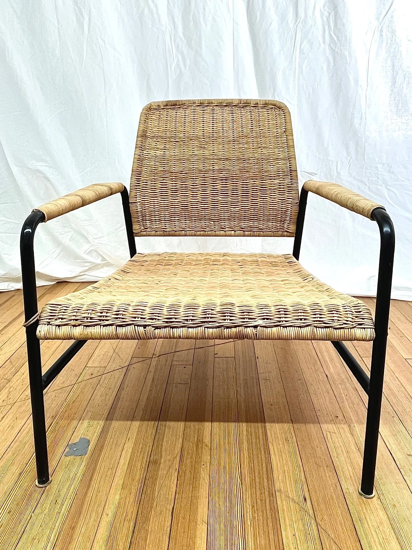 woven-rattan-armchairs-black-metal-frame-front.jpg