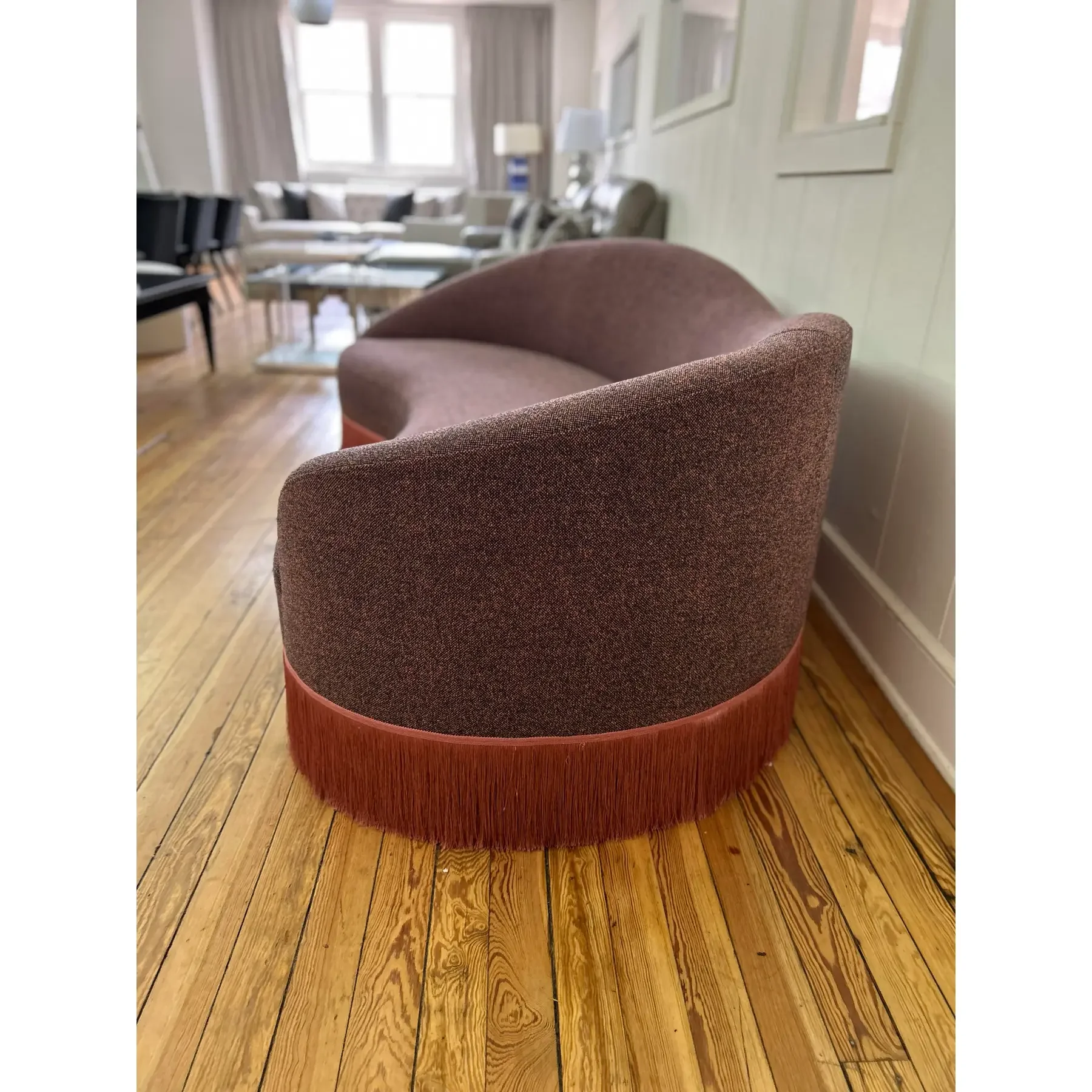 curved-sofa-custom-upholstered-in-maharam-gale-fabric-color-diorite-see-photos-and-trimmed-in-pink-fringe-5095.webp