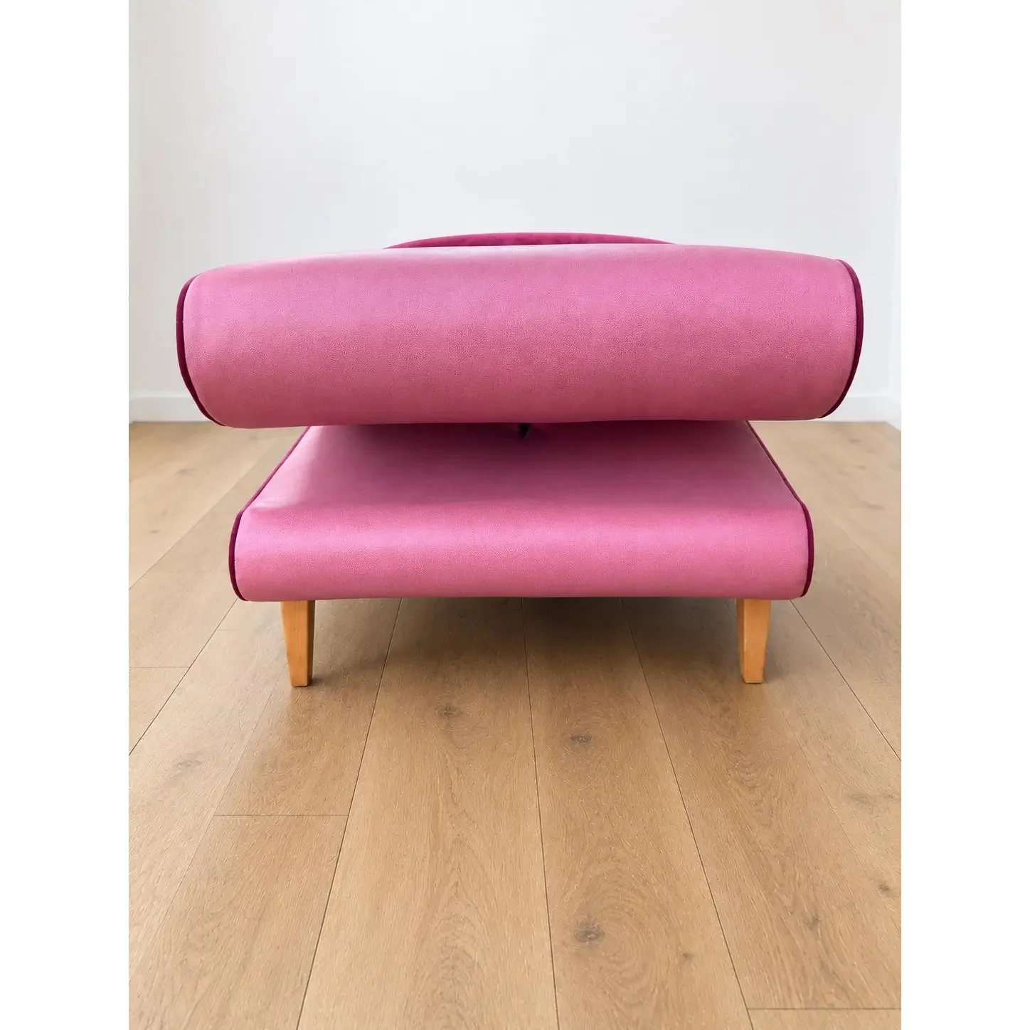 mid-century-modern-chaise-with-adjustable-head-rest-freshly-reupholstered-in-pink-leather-accented-with-cherry-mohair-welting-0403.webp