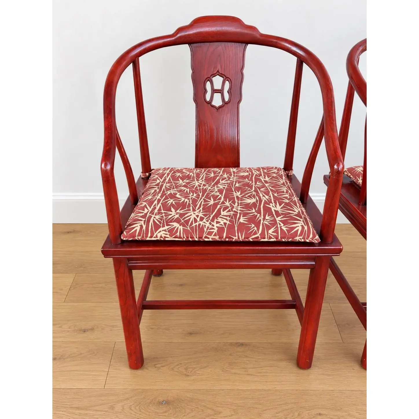 vintage-chinese-horseshoe-back-arm-chairs-with-palm-pattern-seat-cushions-set-of-4-7650.webp