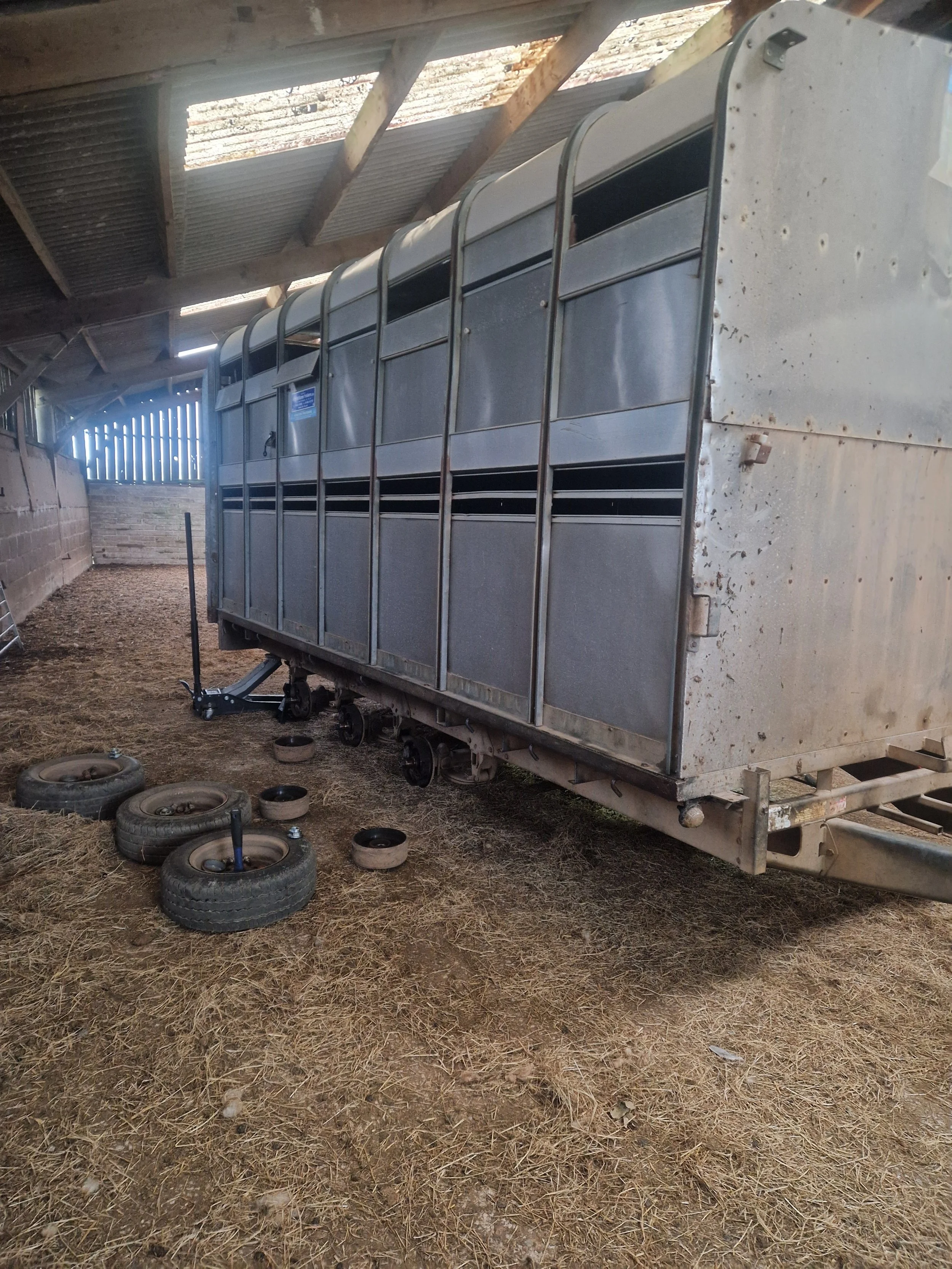 Tri axle cattle box in for a service