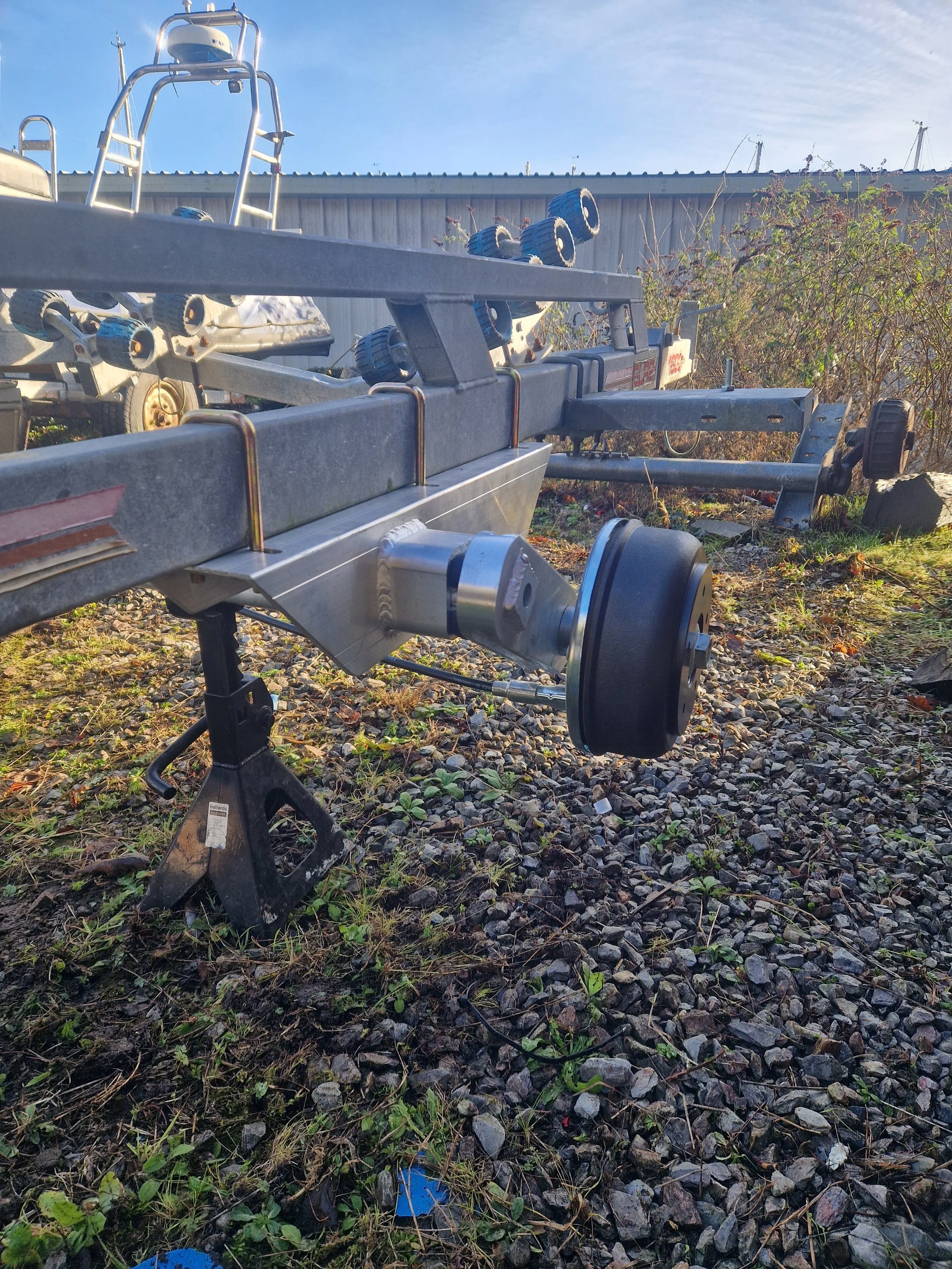 Axle replacement on a boat trailer, using a high tensile aluminium axle rather than corrosive steel