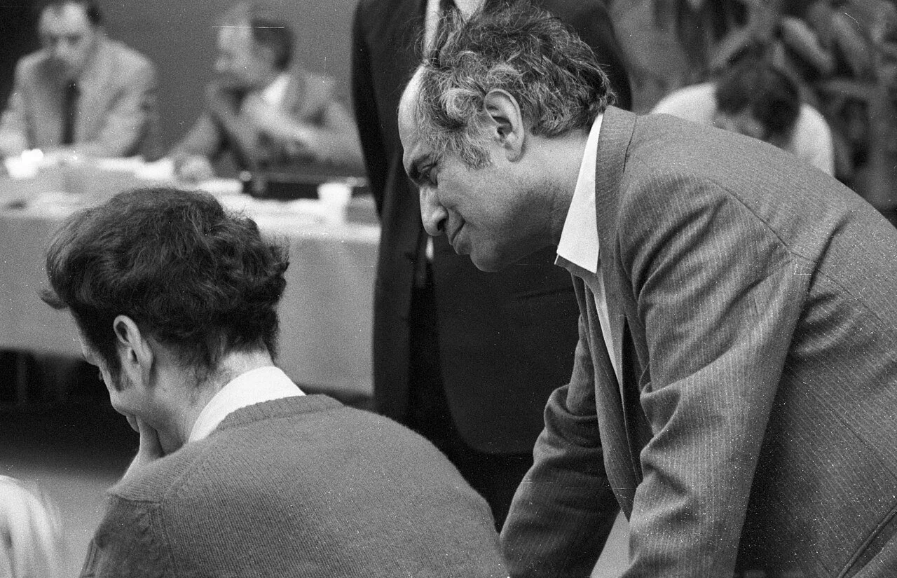 A black and white photo of Mikhail Tal at the Chess Olympiad in Lucern Switzerland, 1982