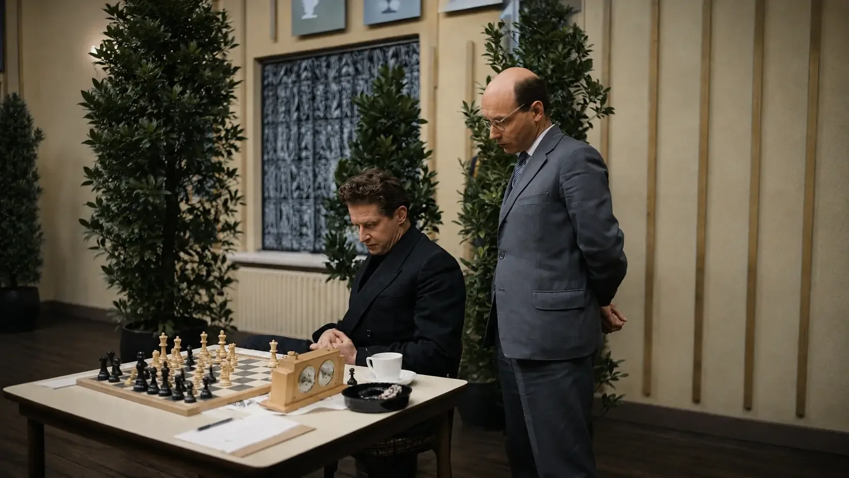 David Bronstein looking over Yuri Avernakh's shoulder at a chess position