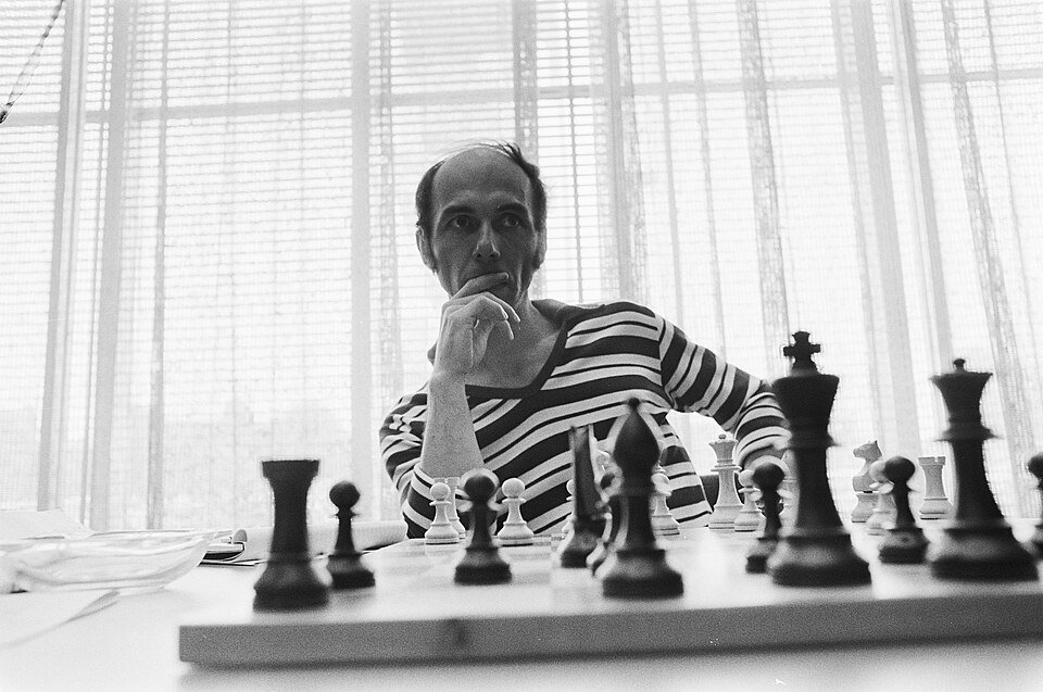 Lubomir Kavalek sitting at a chessboard