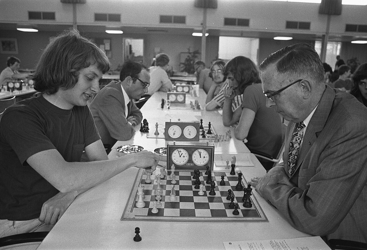 A black and whit photo of Timman in play against Euwe