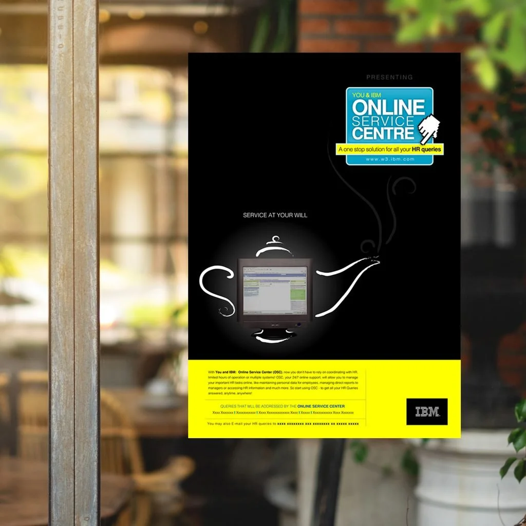 Poster advertising IBM's online service center for HR queries, featuring an image of a computer monitor with a stylized teapot pouring steaming liquid, set against a black background with yellow and blue accents.