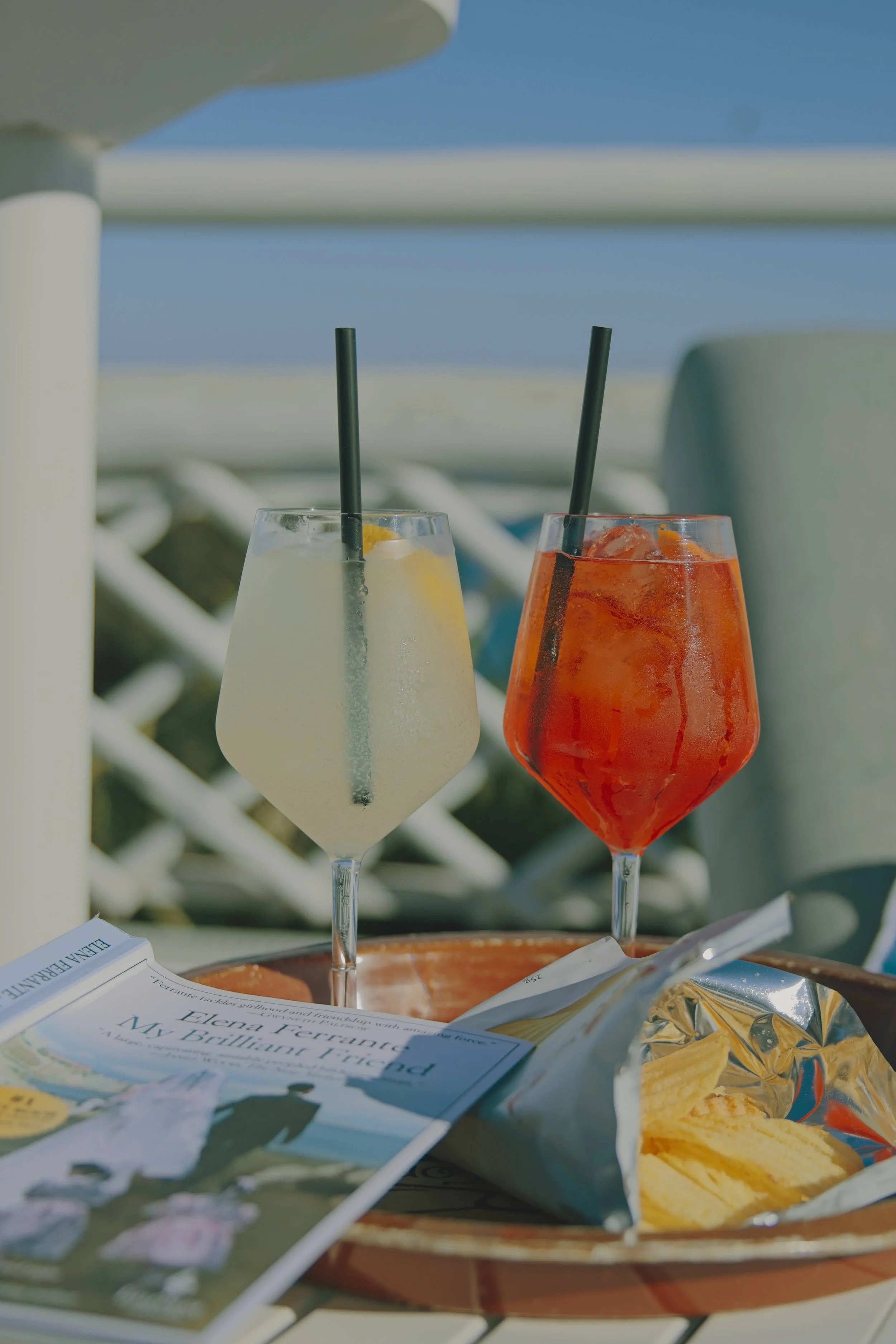 Spritz in Ischia with Elena Ferrante novel and chips