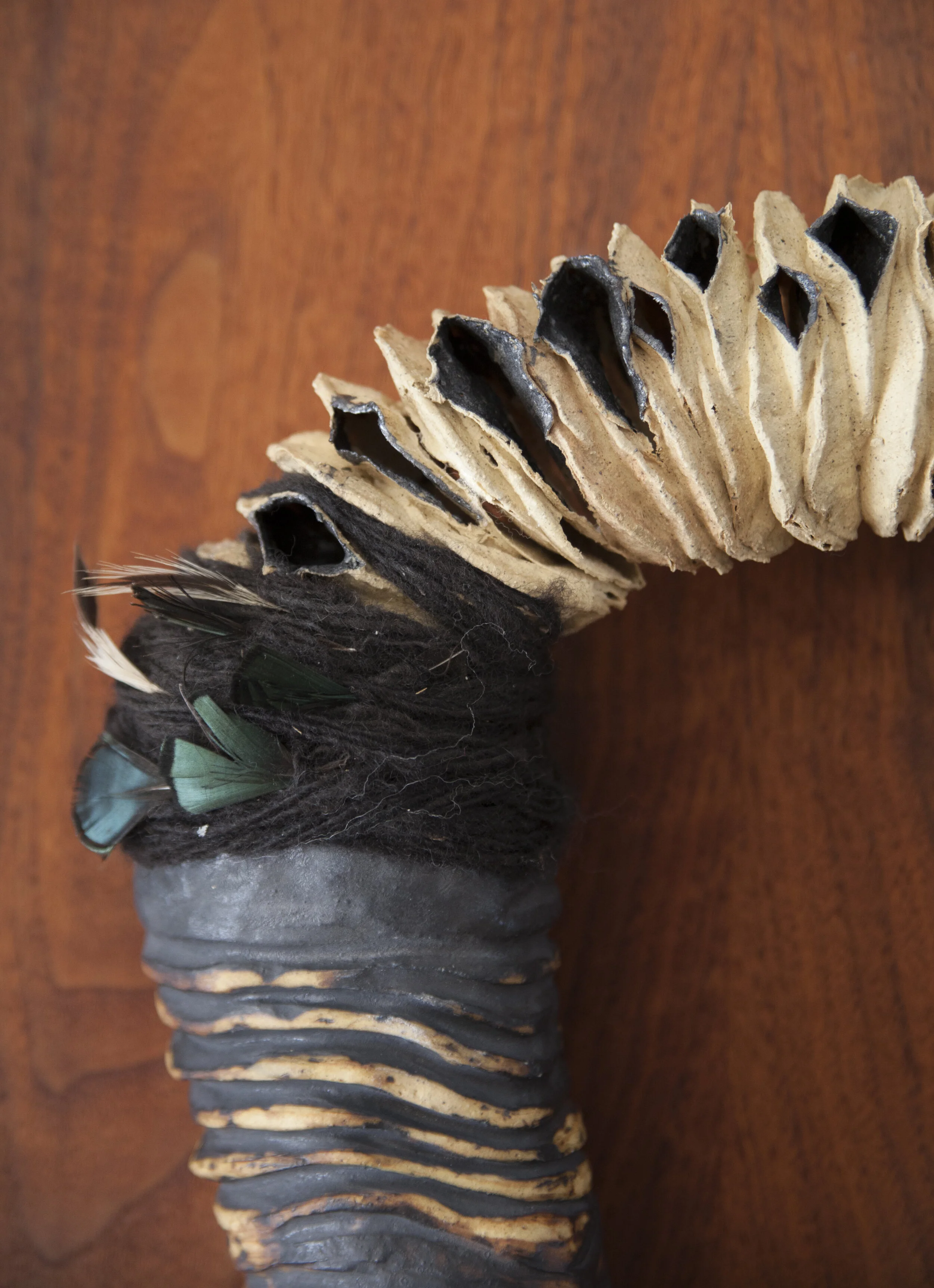 Yoke detail , 28x18x8, ceramic, burnt out cosmetic pads, wool, feathers