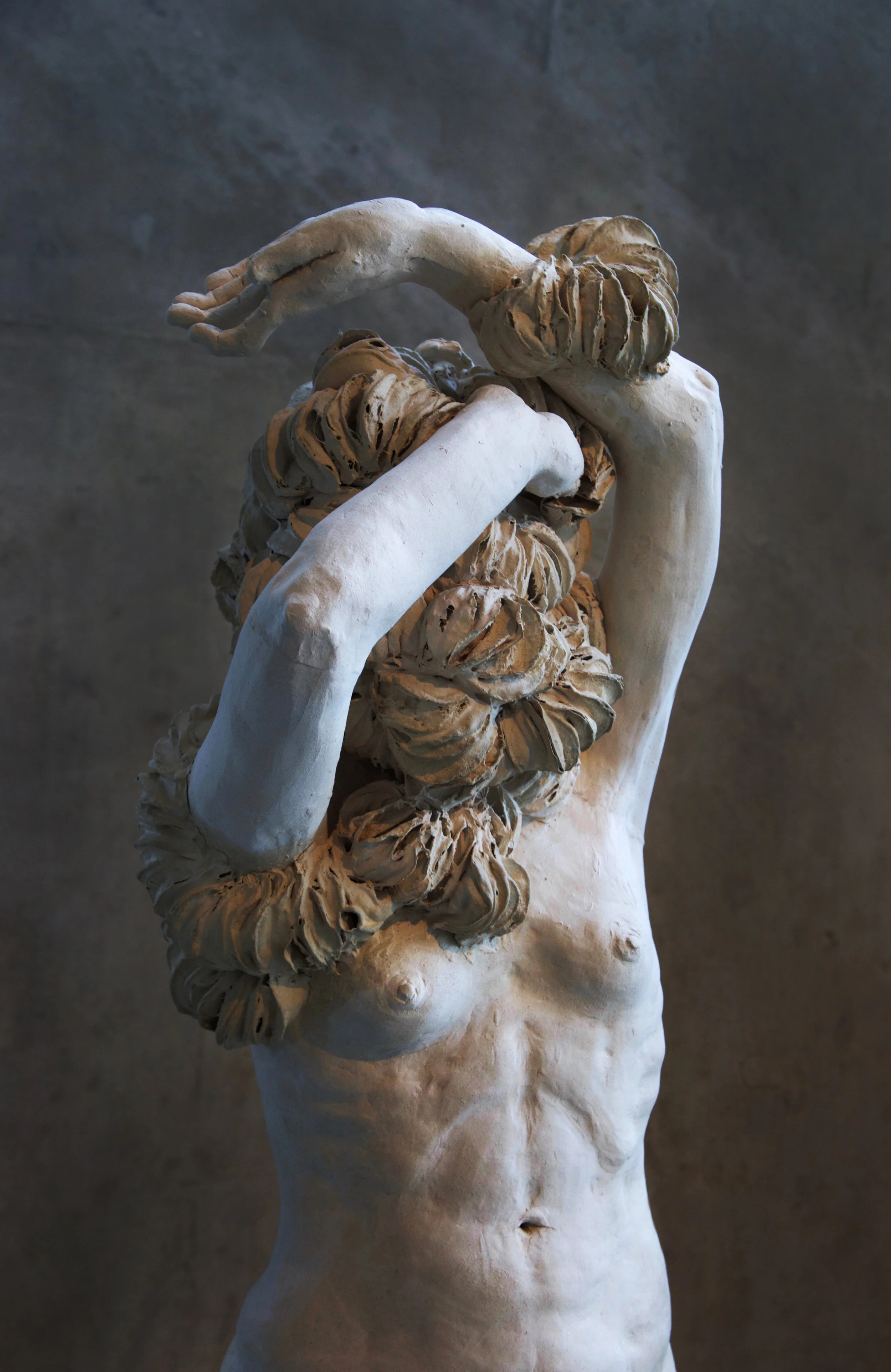 Changing Skin , 48x20x14, stoneware clay, burnt out cosmetic pads