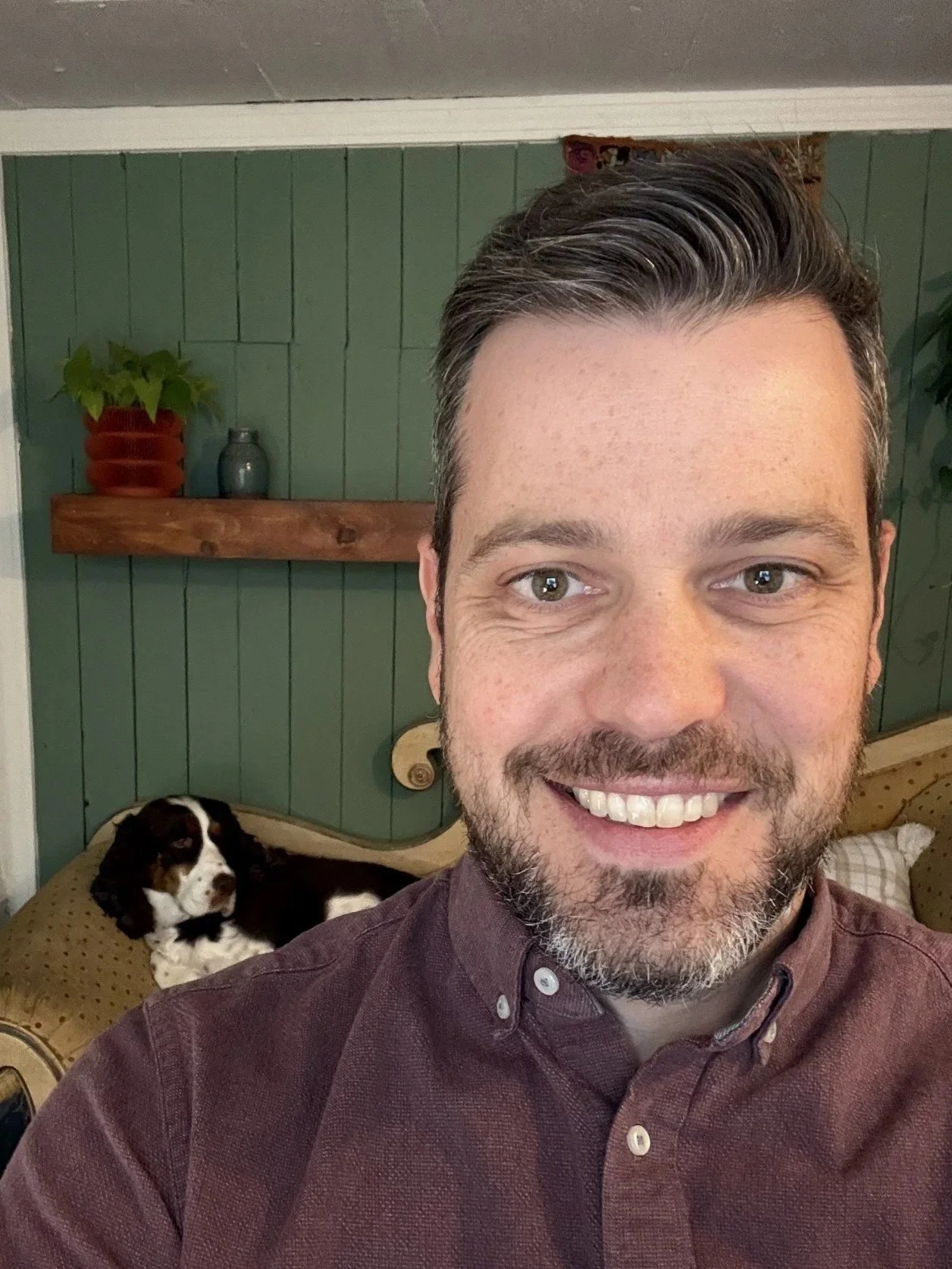 Matt Boucher, LCSW providing ACT telehealth for trauma, PTSD, depression, anxiety in his telehealth office with his dog
