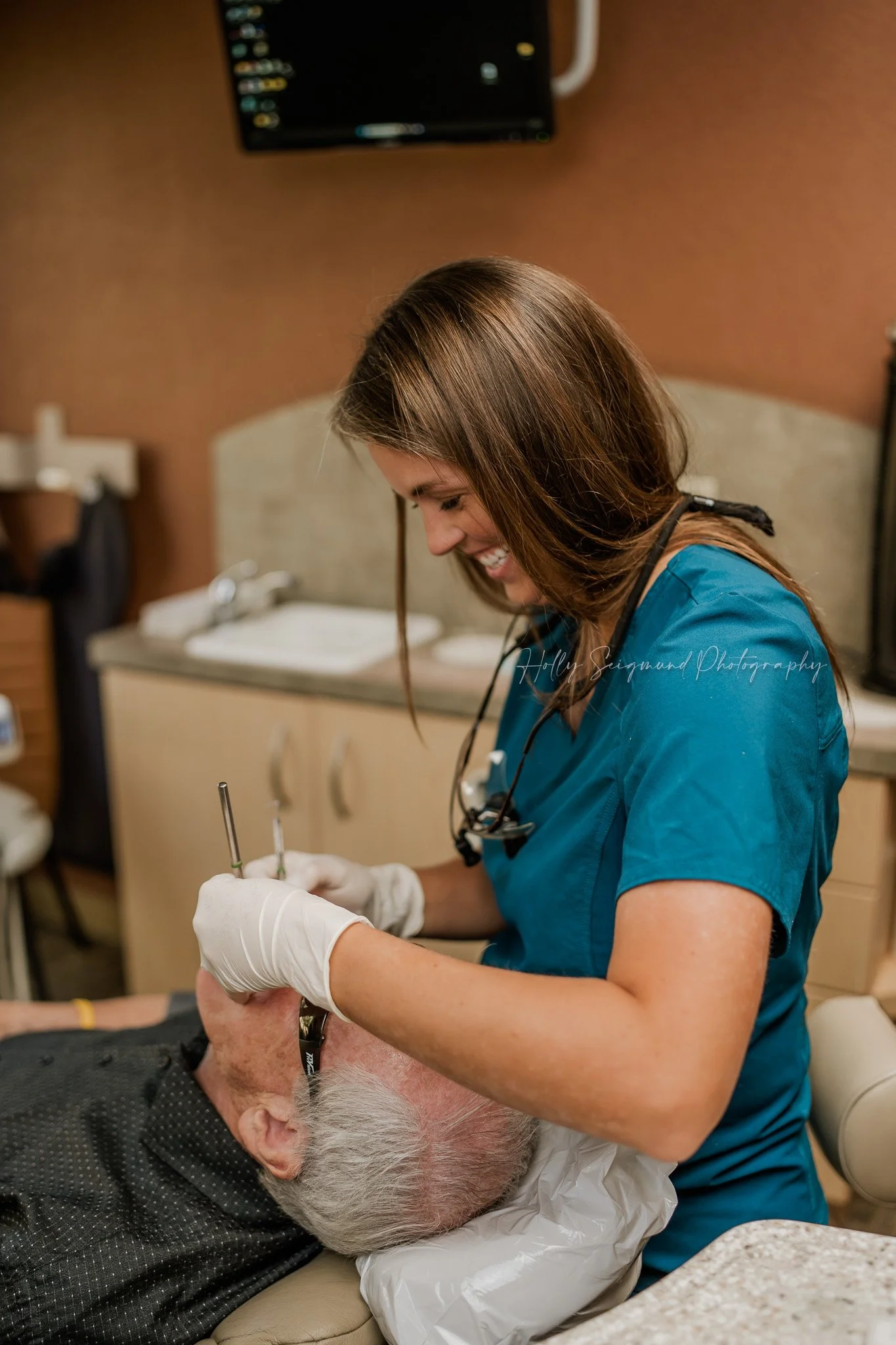 modern office headshot of a dentist in Elgin TX