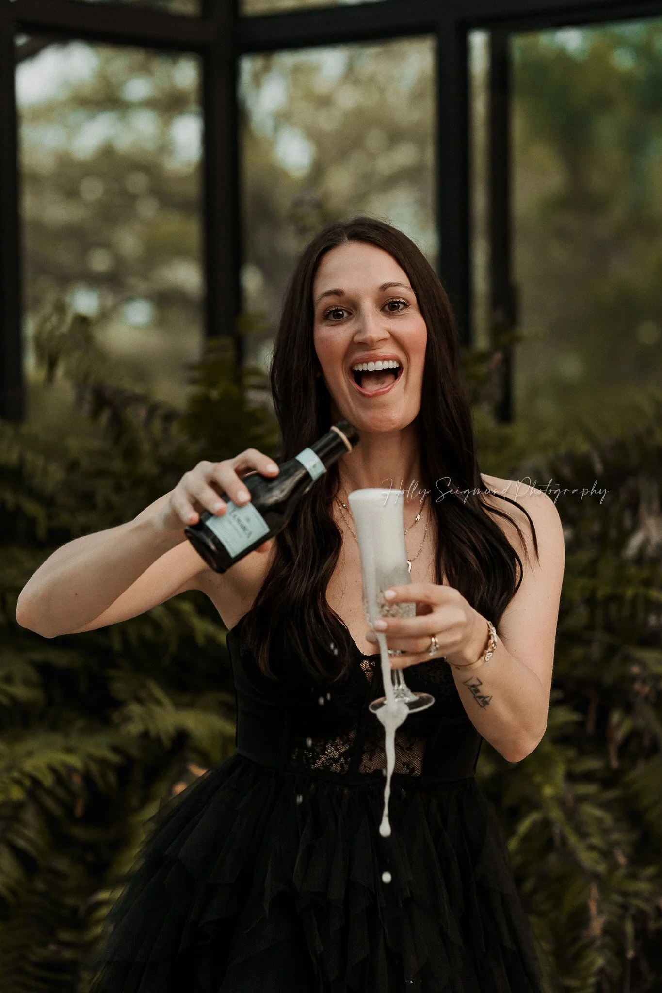 40th birthday portrait of a woman popping champagne in Austin TX