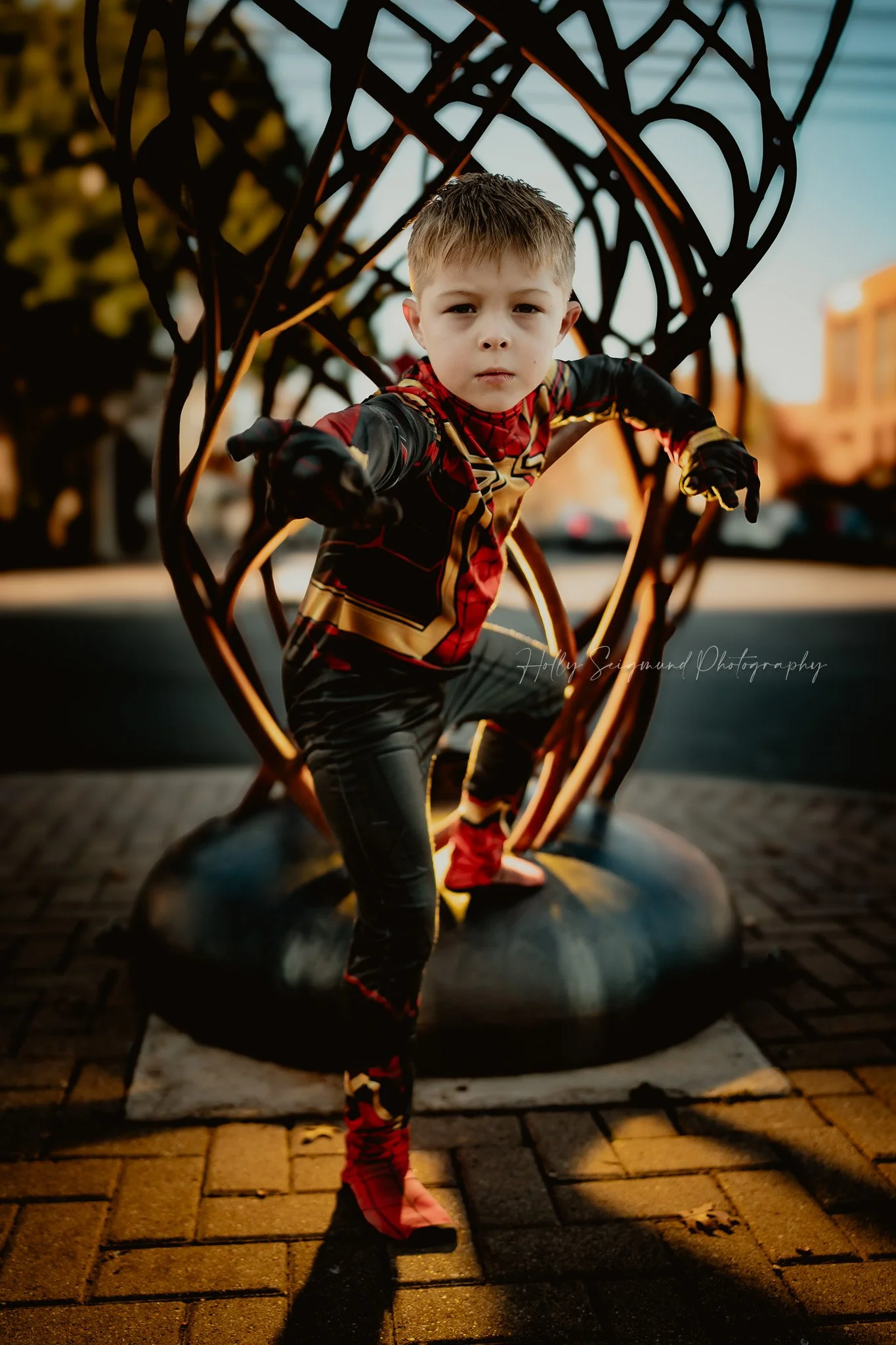 action-style portrait of a 6-year-old in Spiderman costume taken by Georgetown Texas birthday photographer