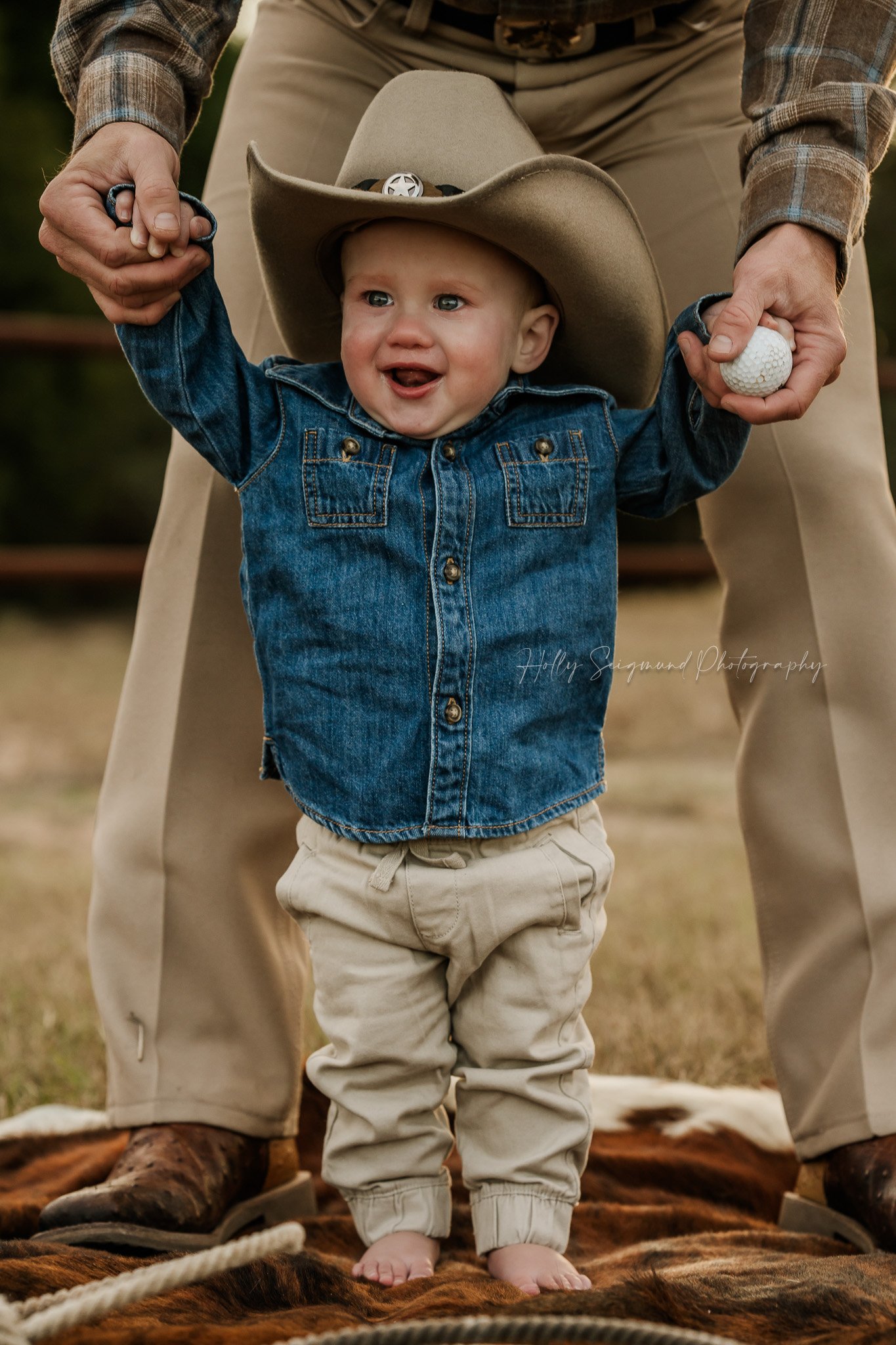 Little cowboy first birthday photos outdoors in Bastrop County Texas