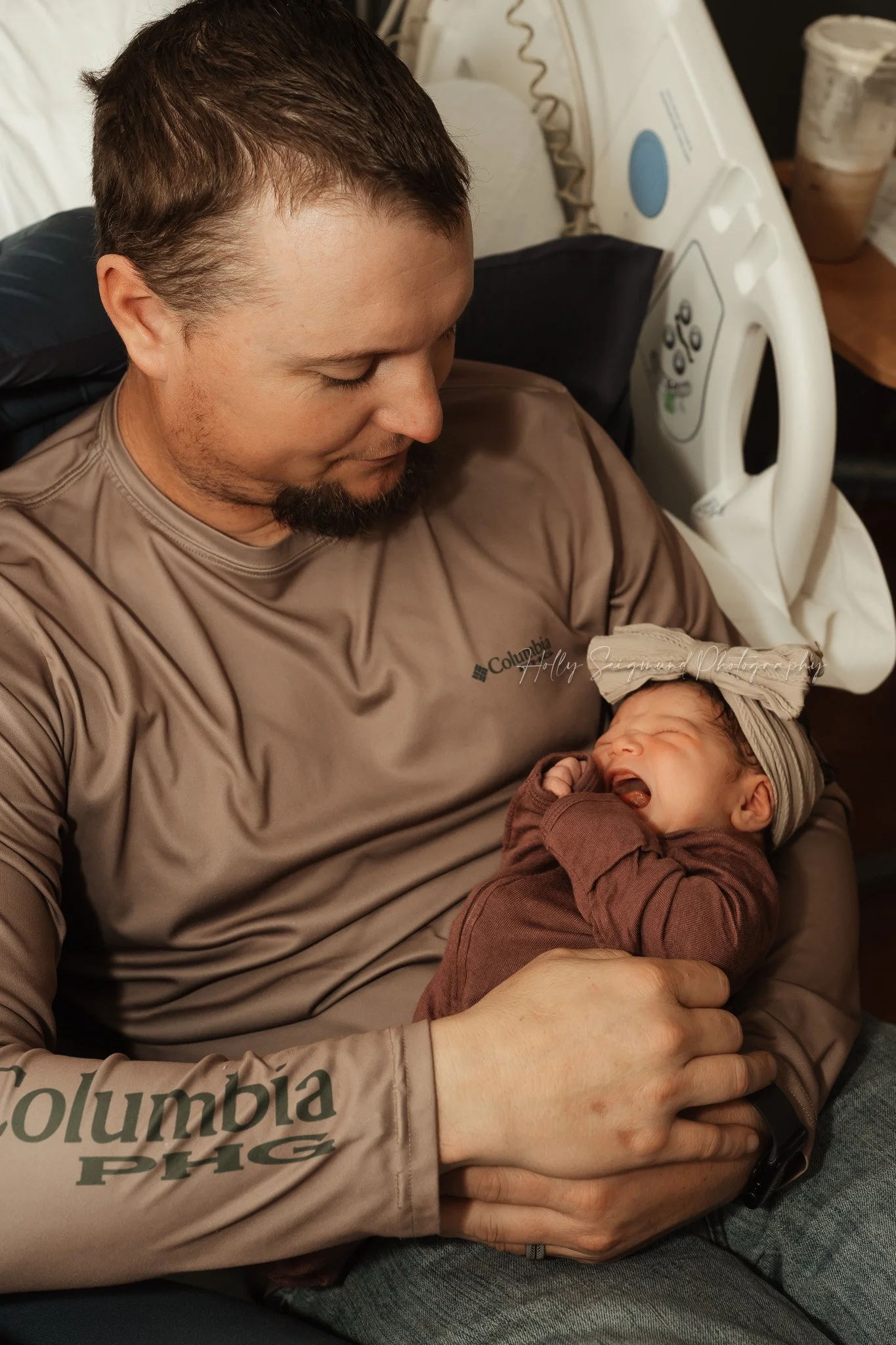 Father meeting newborn baby at St. David’s Georgetown Hospital in Georgetown, TX