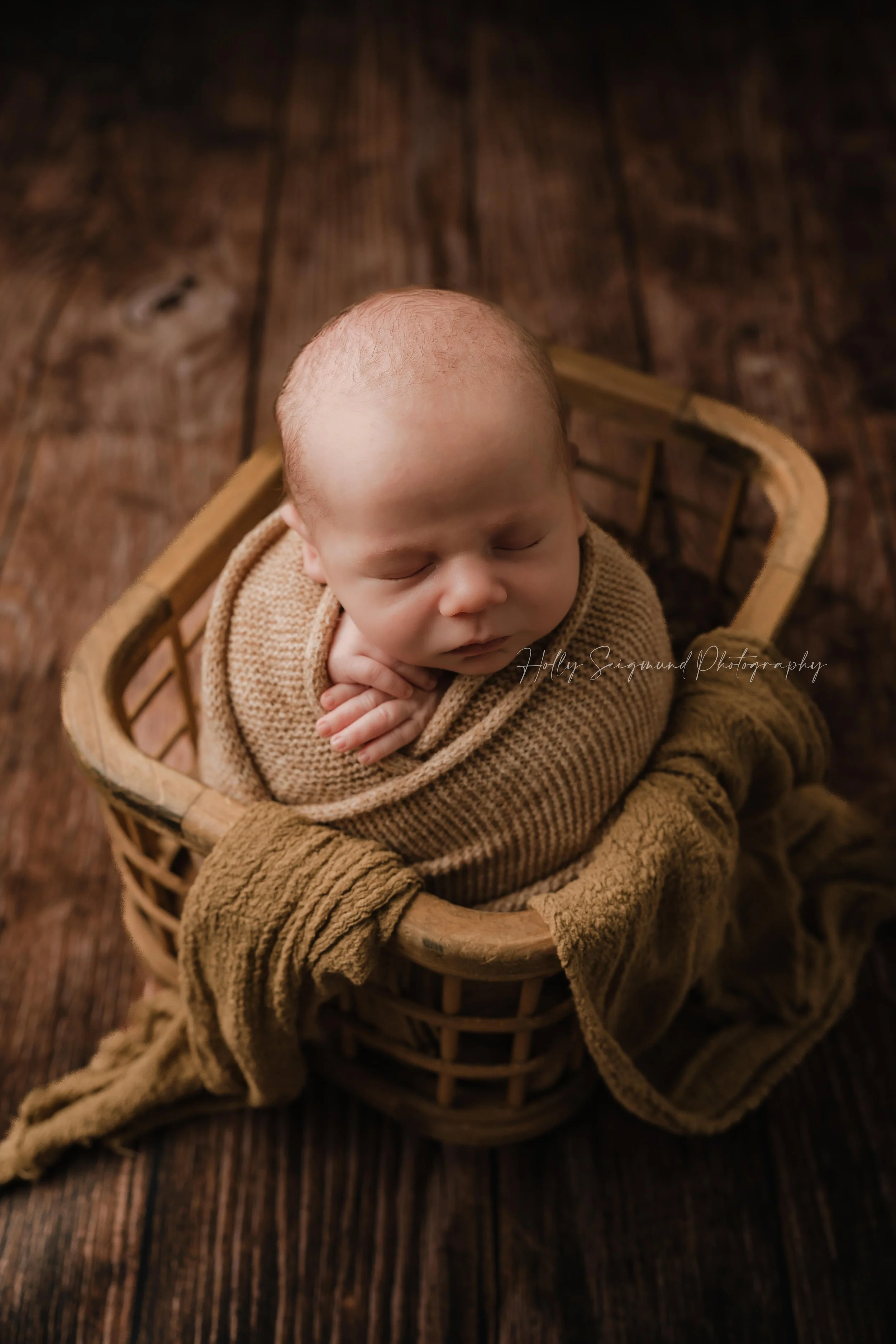 Baby newborn boy during a in-home newborn photography session in Bastrop County Texas