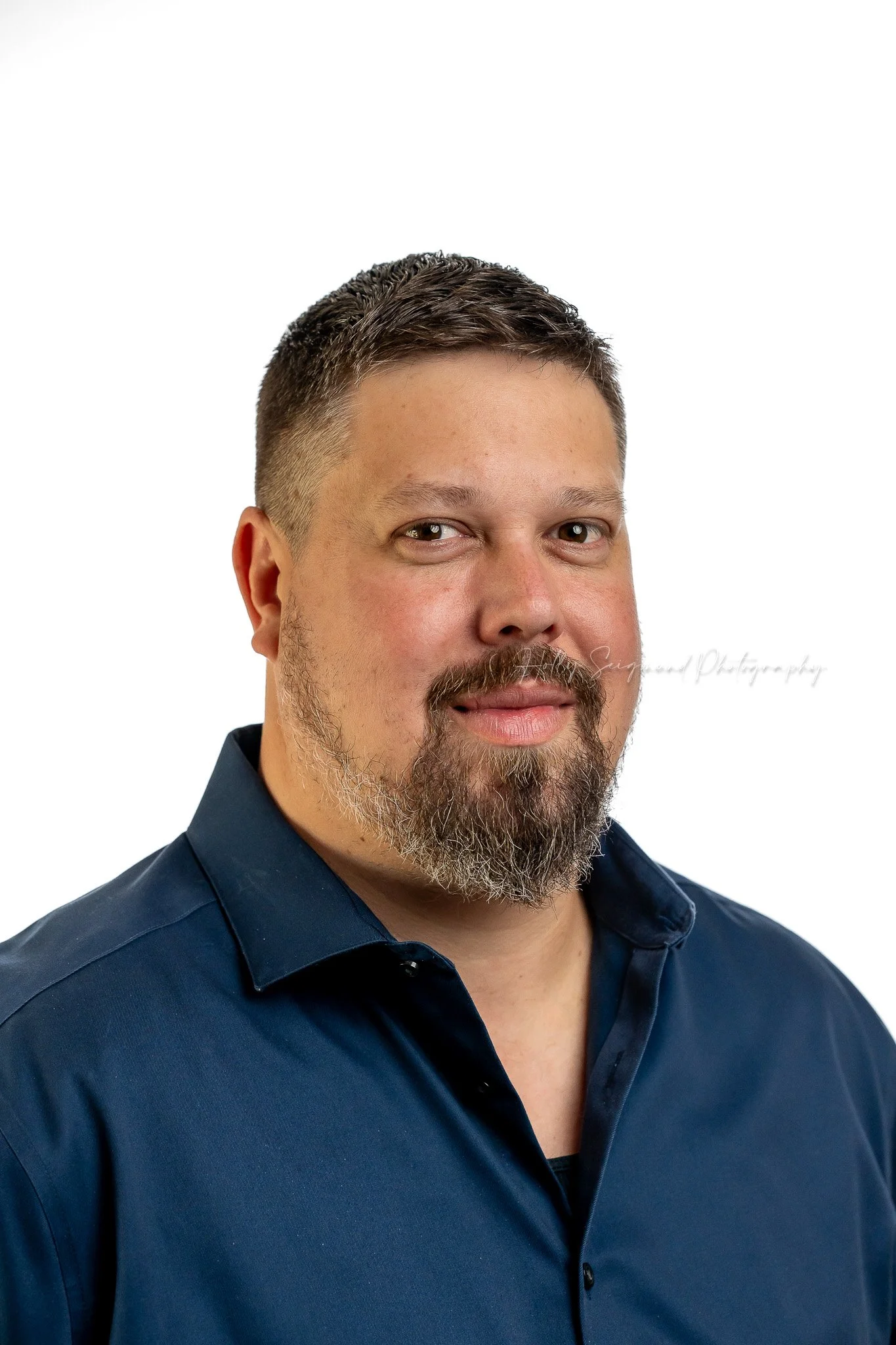 business headshot taken in a studio with a white background in Austin TX