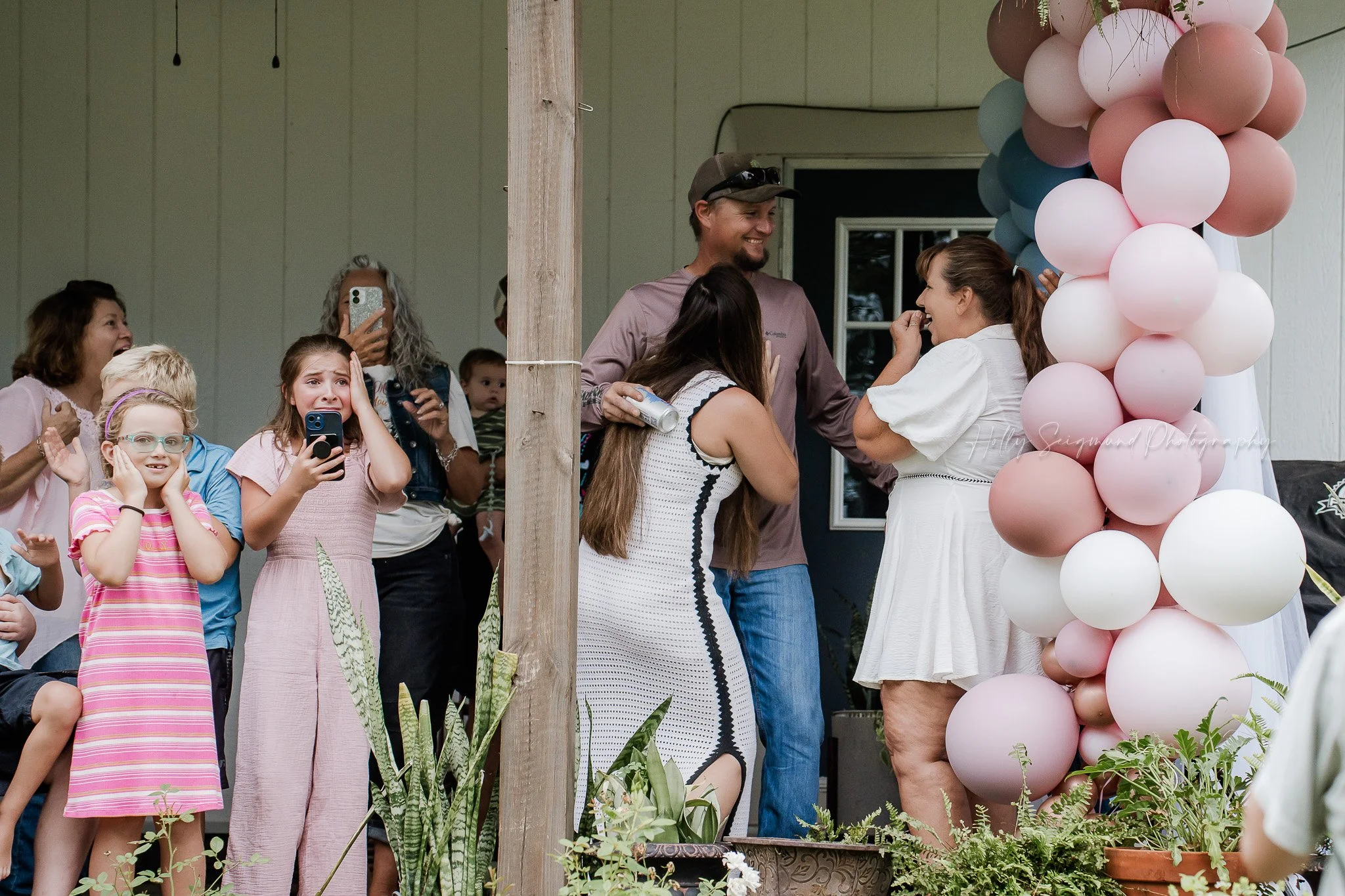Guests celebrating at baby shower photographed in Central Texas