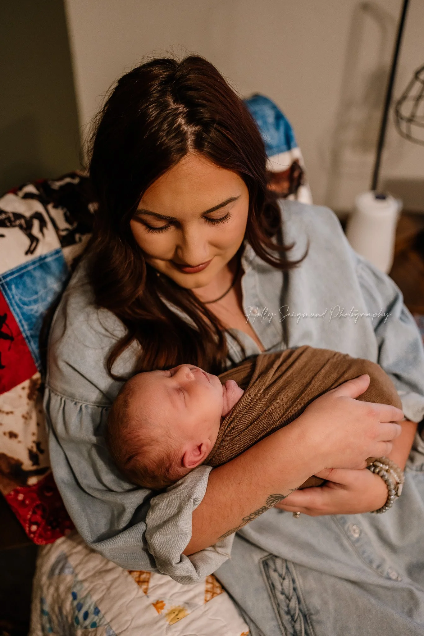 Mom and newborn baby during an in-home newborn session in Central Texas
