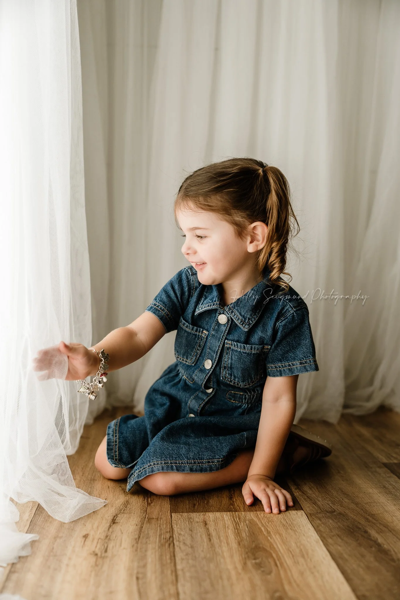 2nd birthday portrait of a little girl in a natural light studio in Lexington Texas
