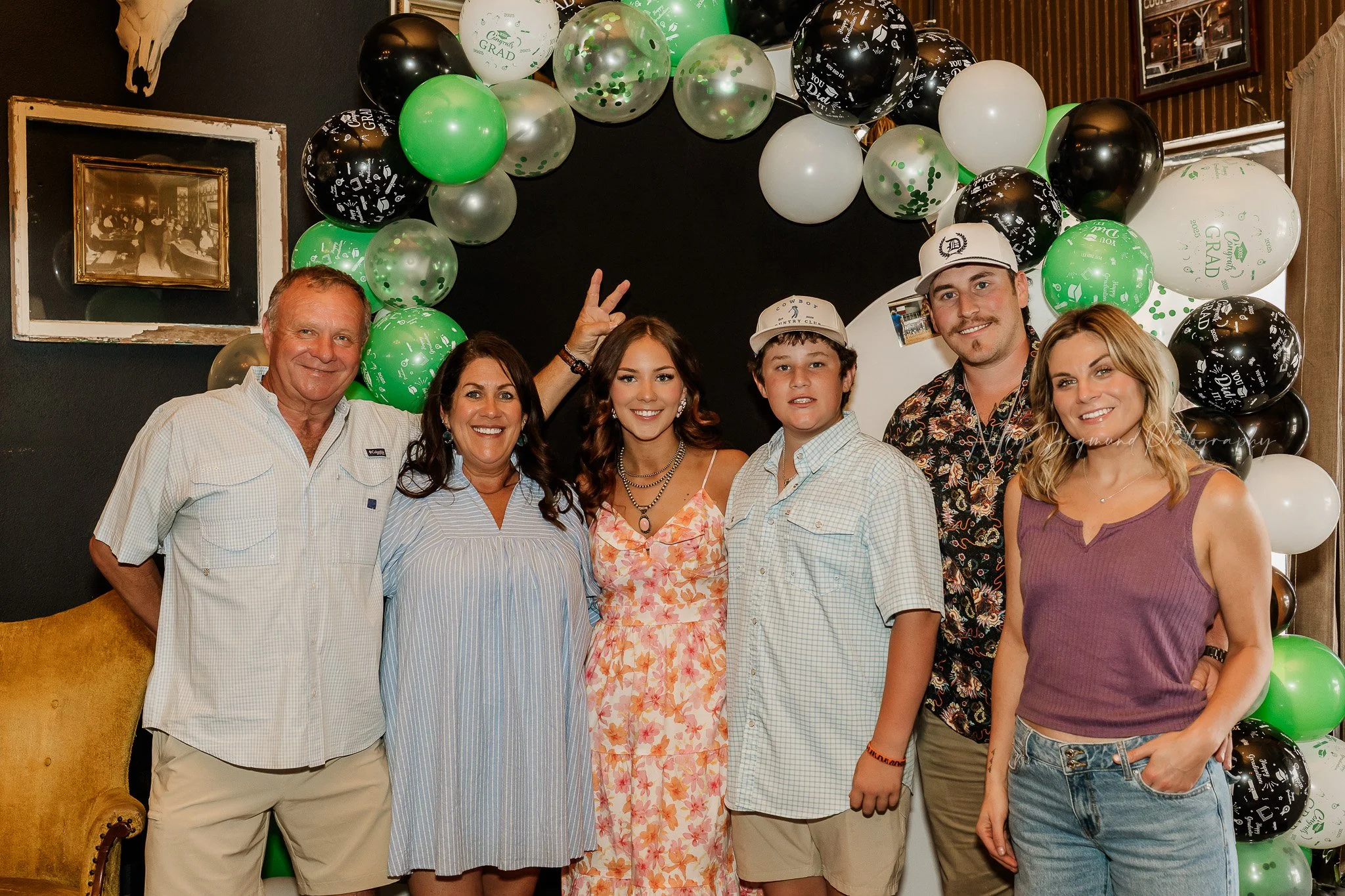 Senior graduation event photography in Coupland Texas with guests celebrating