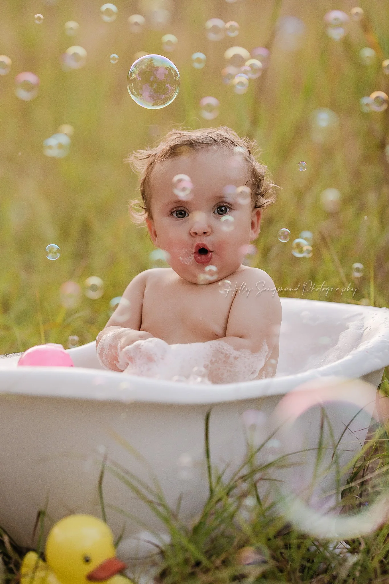 First birthday bubble bath in the grass in Central Texas