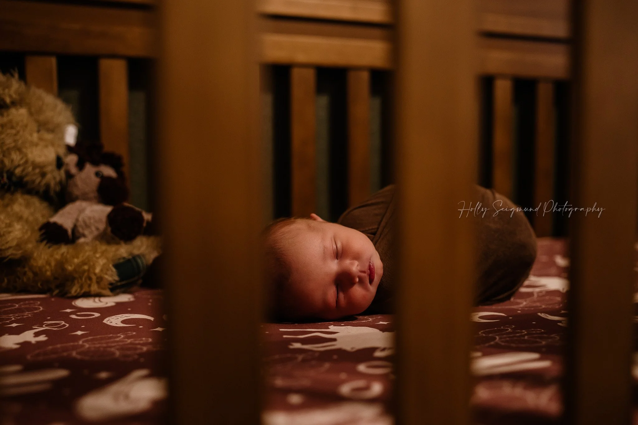 Newborn baby in his crib during newborn in-home session in Central Texas