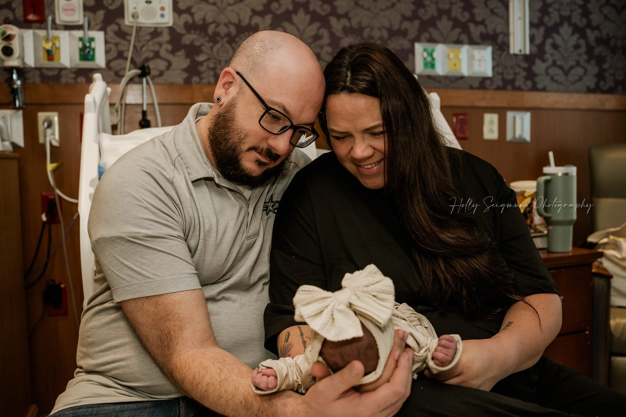 Parents with newborn in hospital room at St. David’s Women’s Center of Texas in Austin