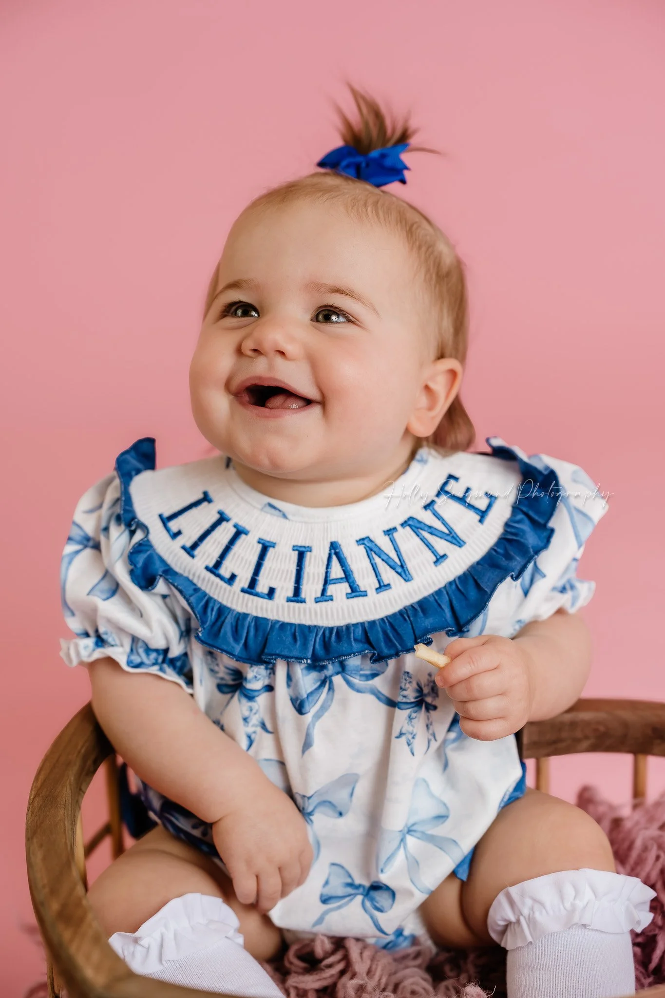 Simple pink paper with flash photography for girls first birthday photos in a studio in Central Texas