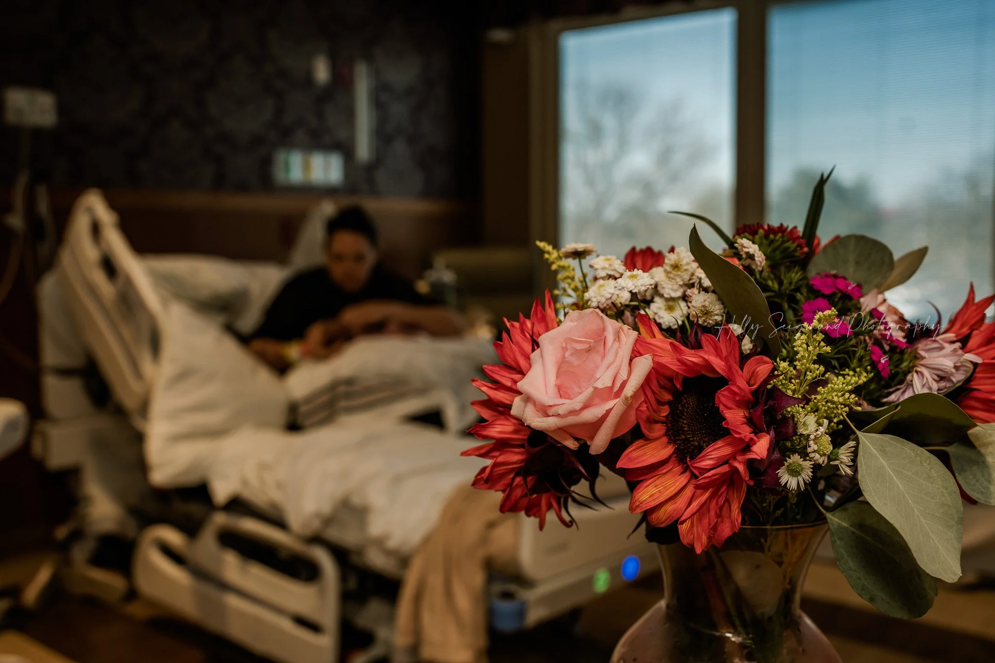 Parents with their newborn baby in hospital room in Austin, TX