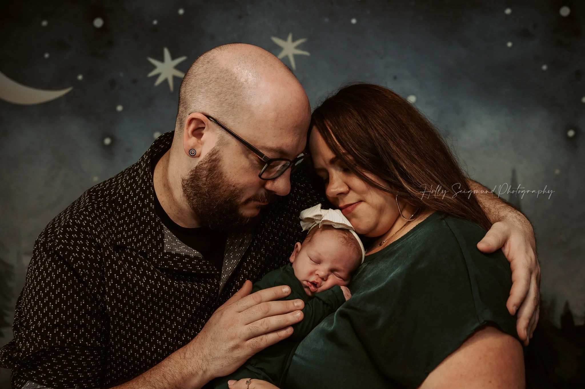 Moody toned family newborn photo in baby's nursery in Central Texas