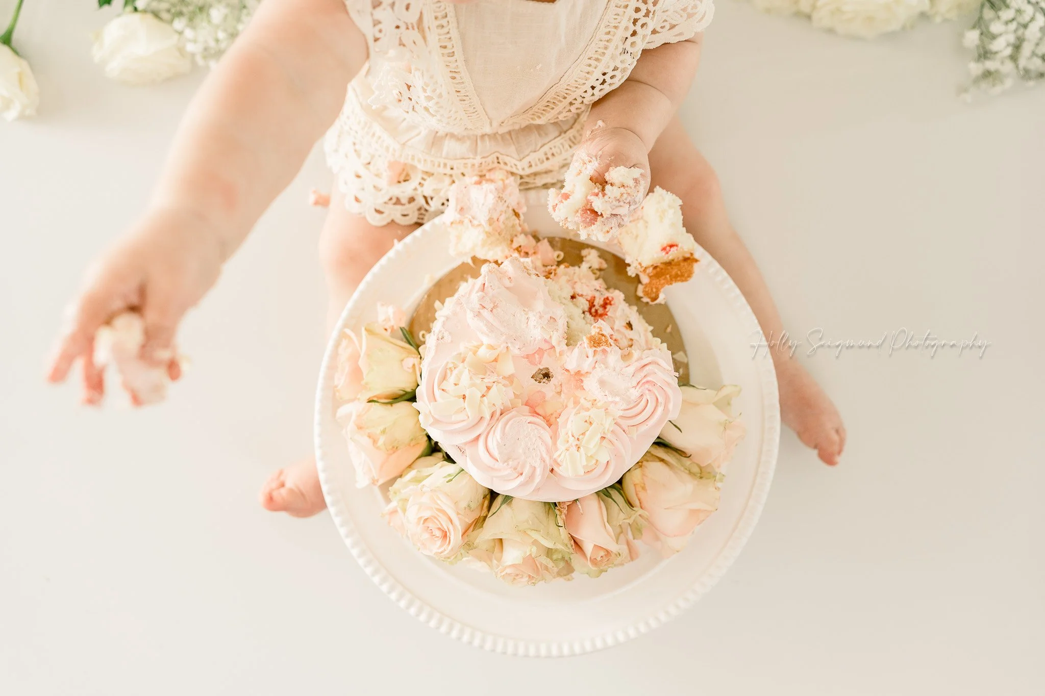 Natural light studio smash cake session for girls birthday with florals in Lee County Texas